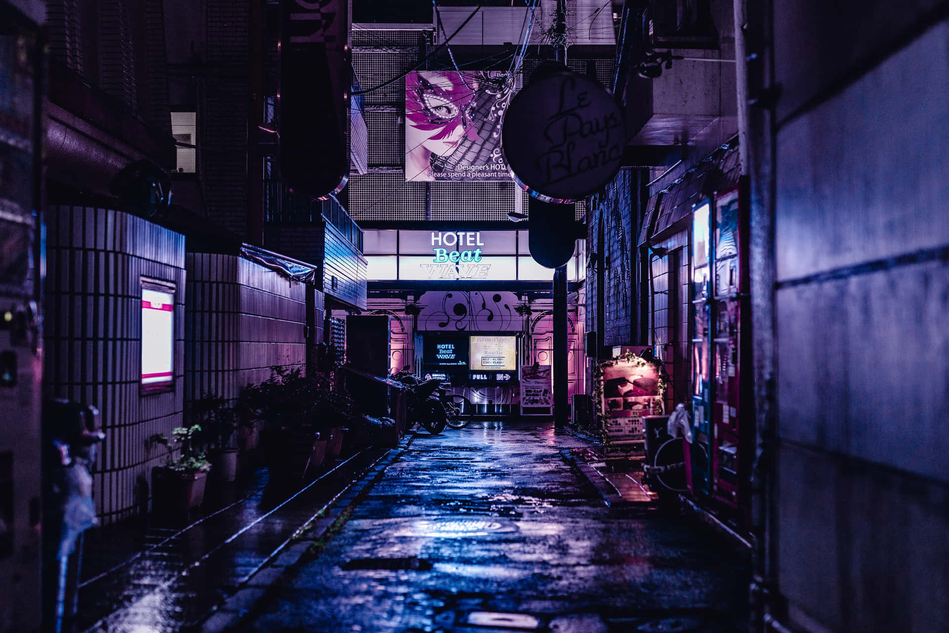 An alleyway in the city at night Wallpaper