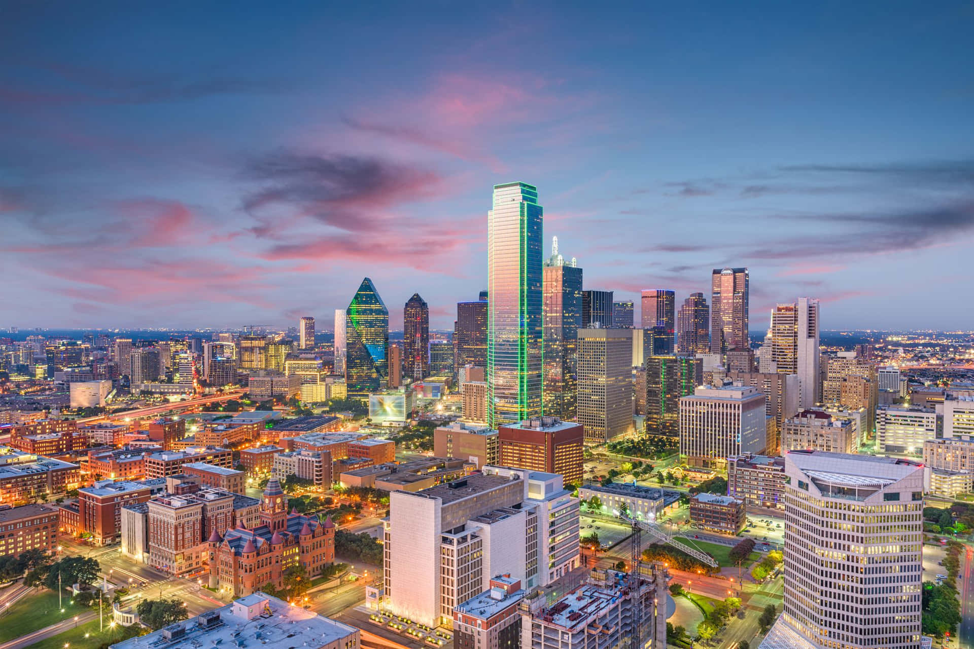 Alluring Aerial View Of Dallas Cityscape At Sunset Wallpaper