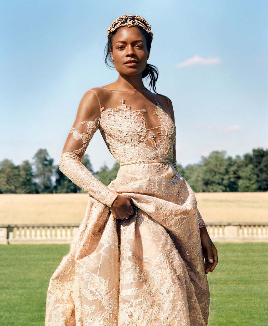 "alluring Naomie Harris Posing Against A Scenic View" Wallpaper