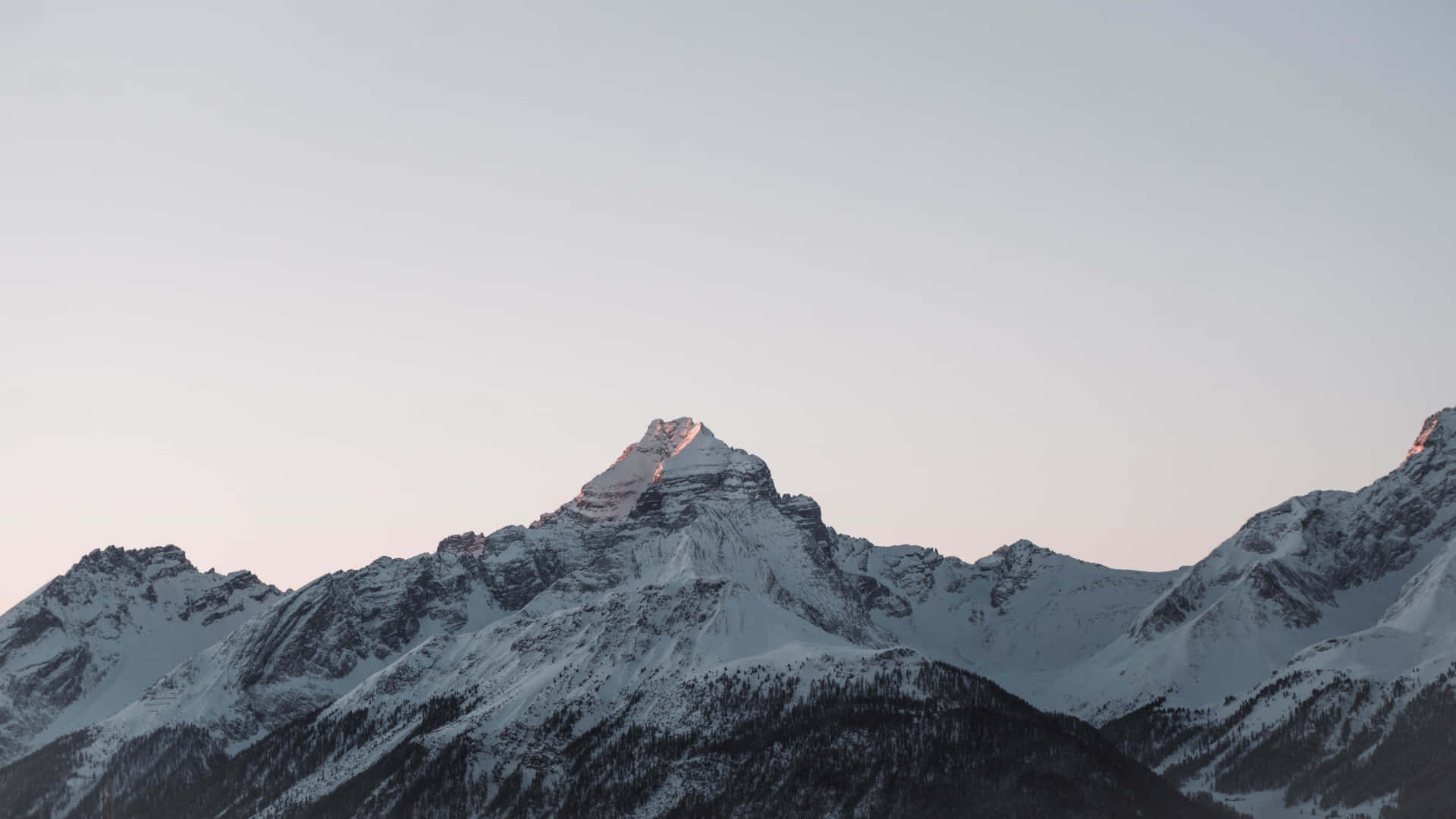 Alpine Glow Snowy Mountain Peaks Wallpaper