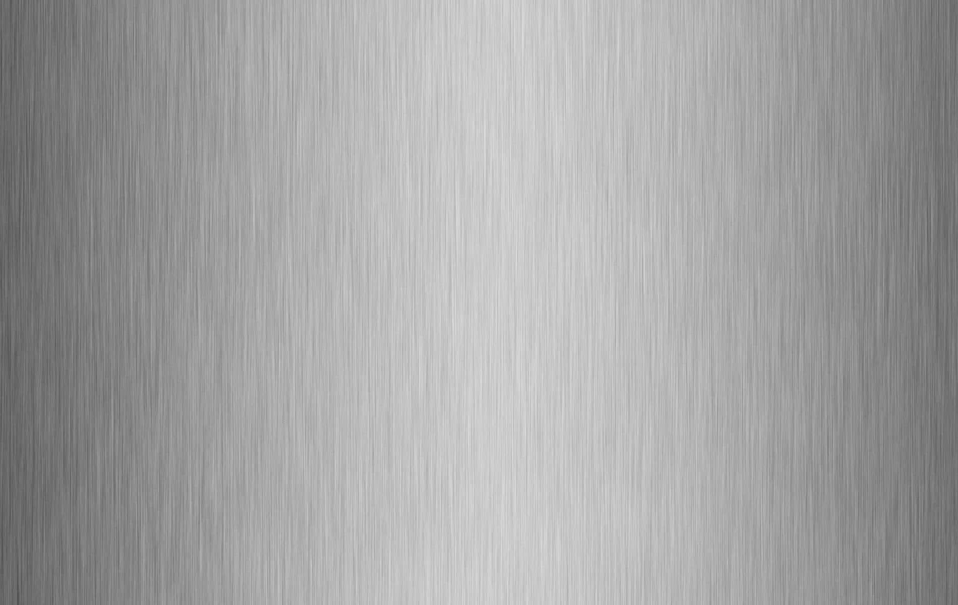 A Silver Metal Background With A Textured Surface