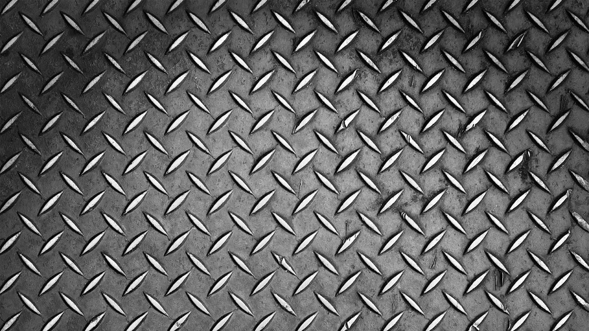 A Black And White Photo Of A Metal Plate