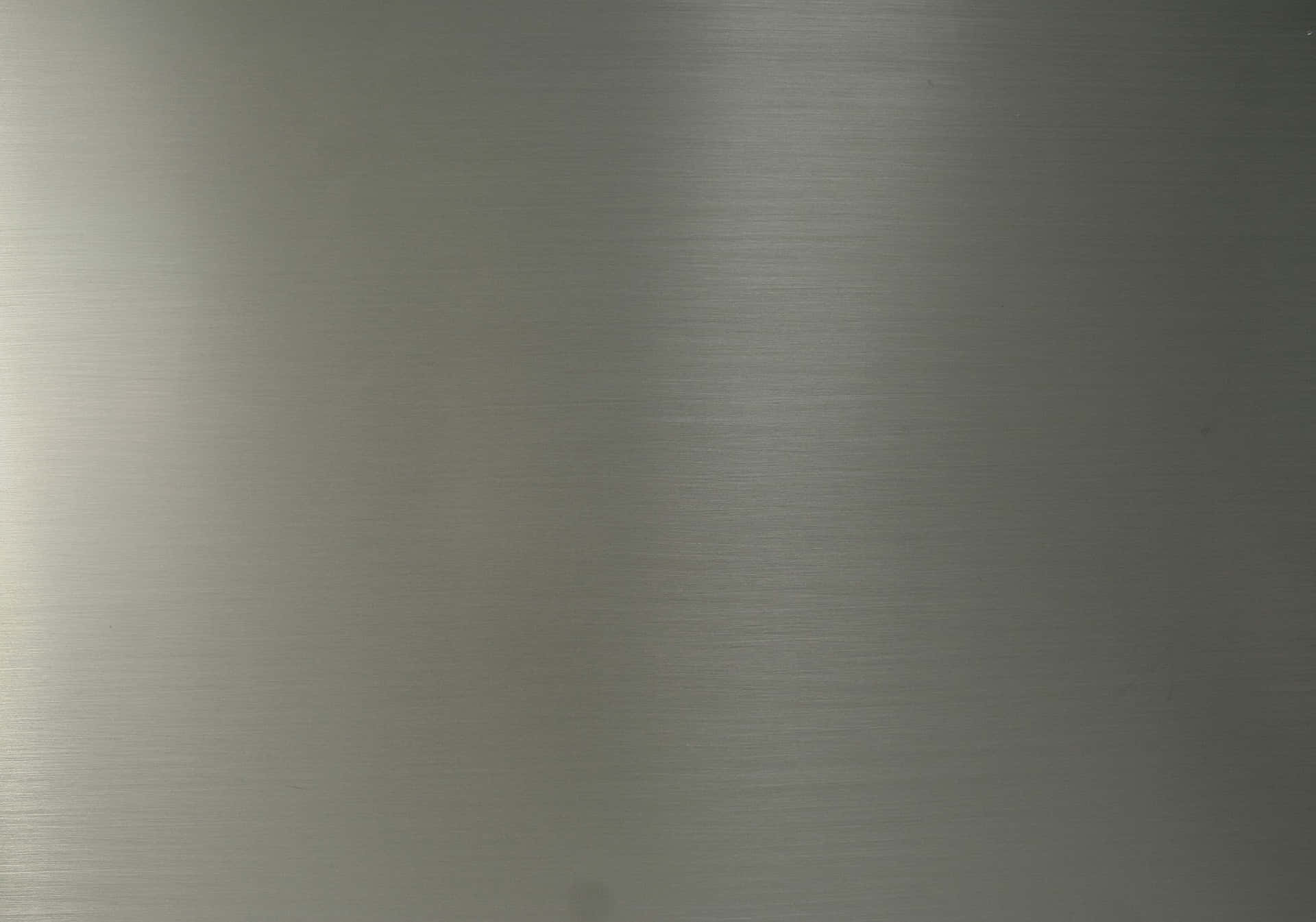 Ennärbild Av En Silvermetallplatta (in Context Of Computer/mobile Wallpaper).
