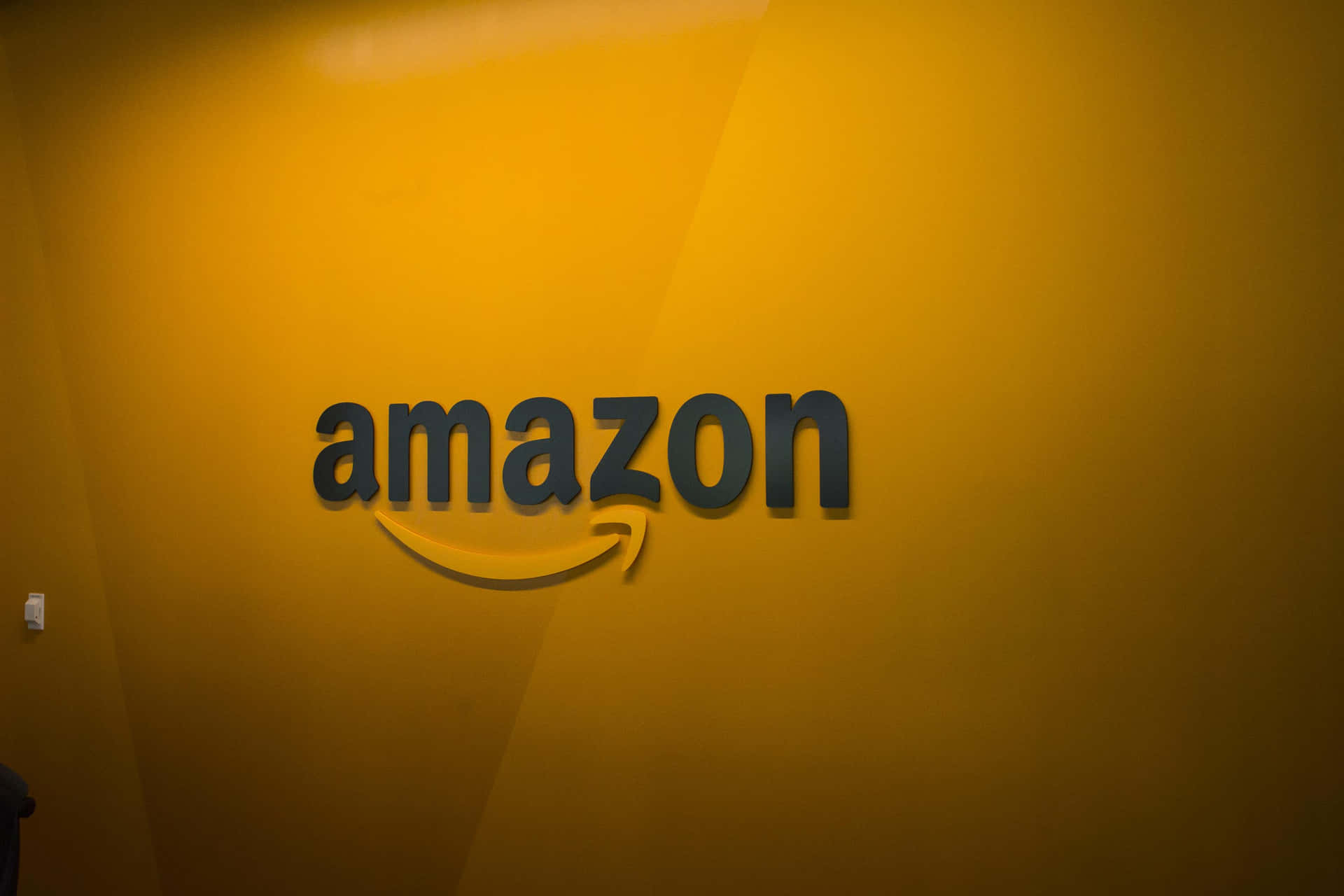 Download Amazon Uk Logo In Yellow-orange Wall Wallpaper | Wallpapers.com