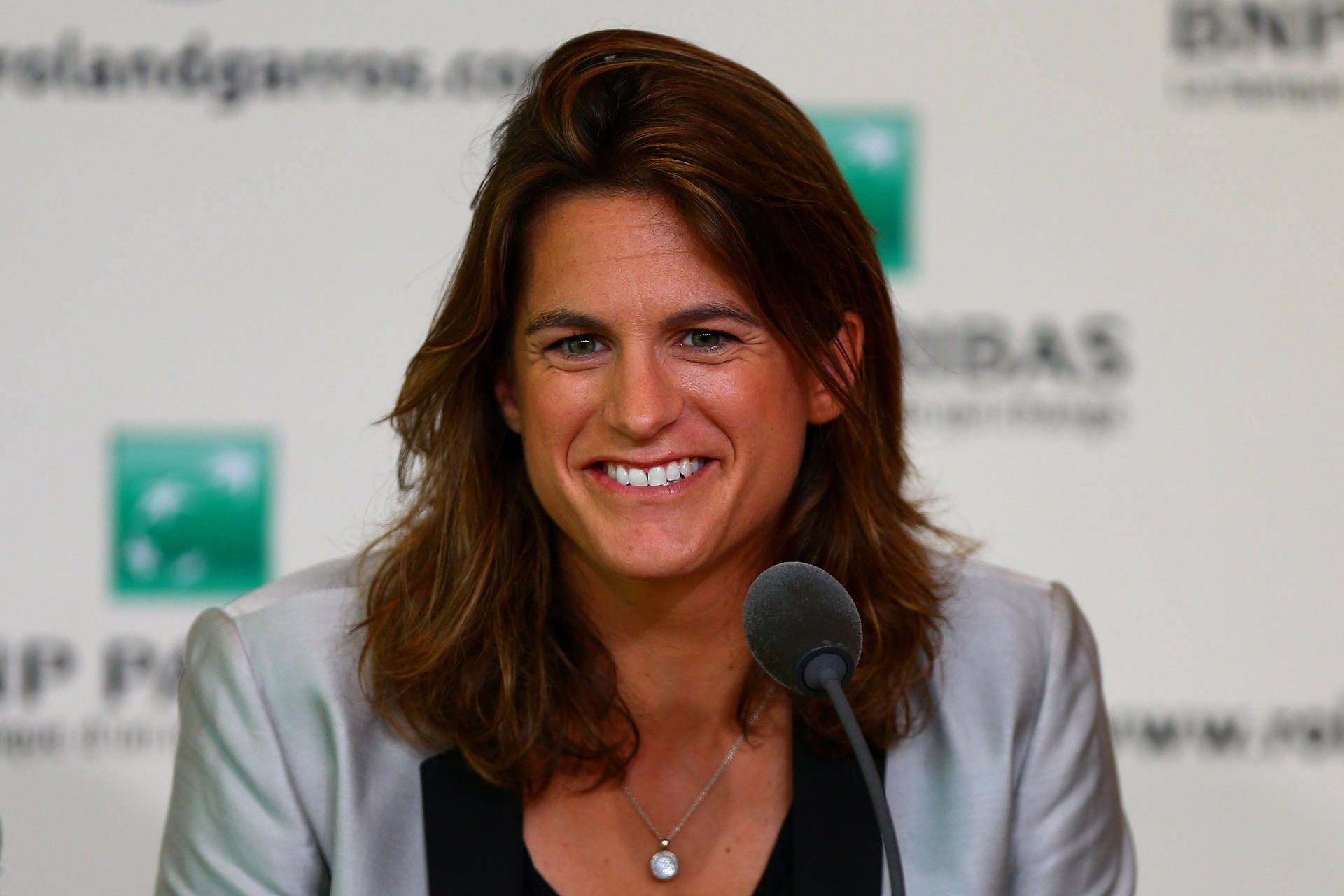 Amélie Mauresmo at a Press Conference Wallpaper