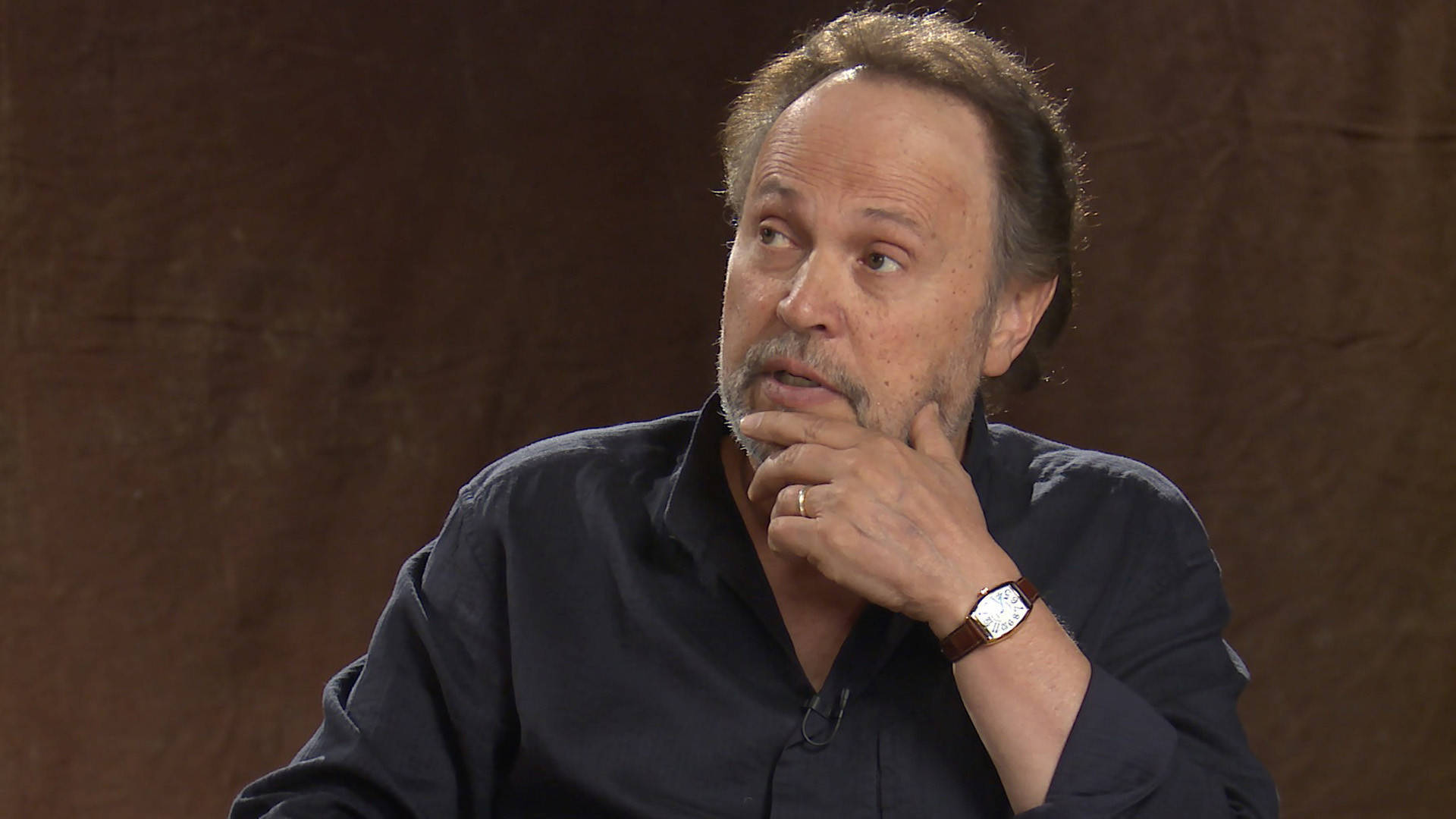 "Billy Crystal, the Renowned American Actor, Engaging in an Interview" Wallpaper