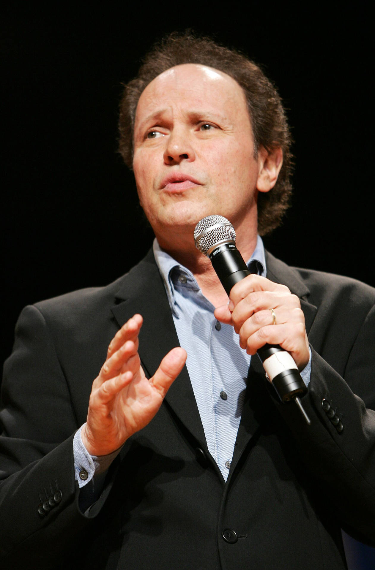 Legendary Comedian and Actor Billy Crystal Performs Onstage Wallpaper