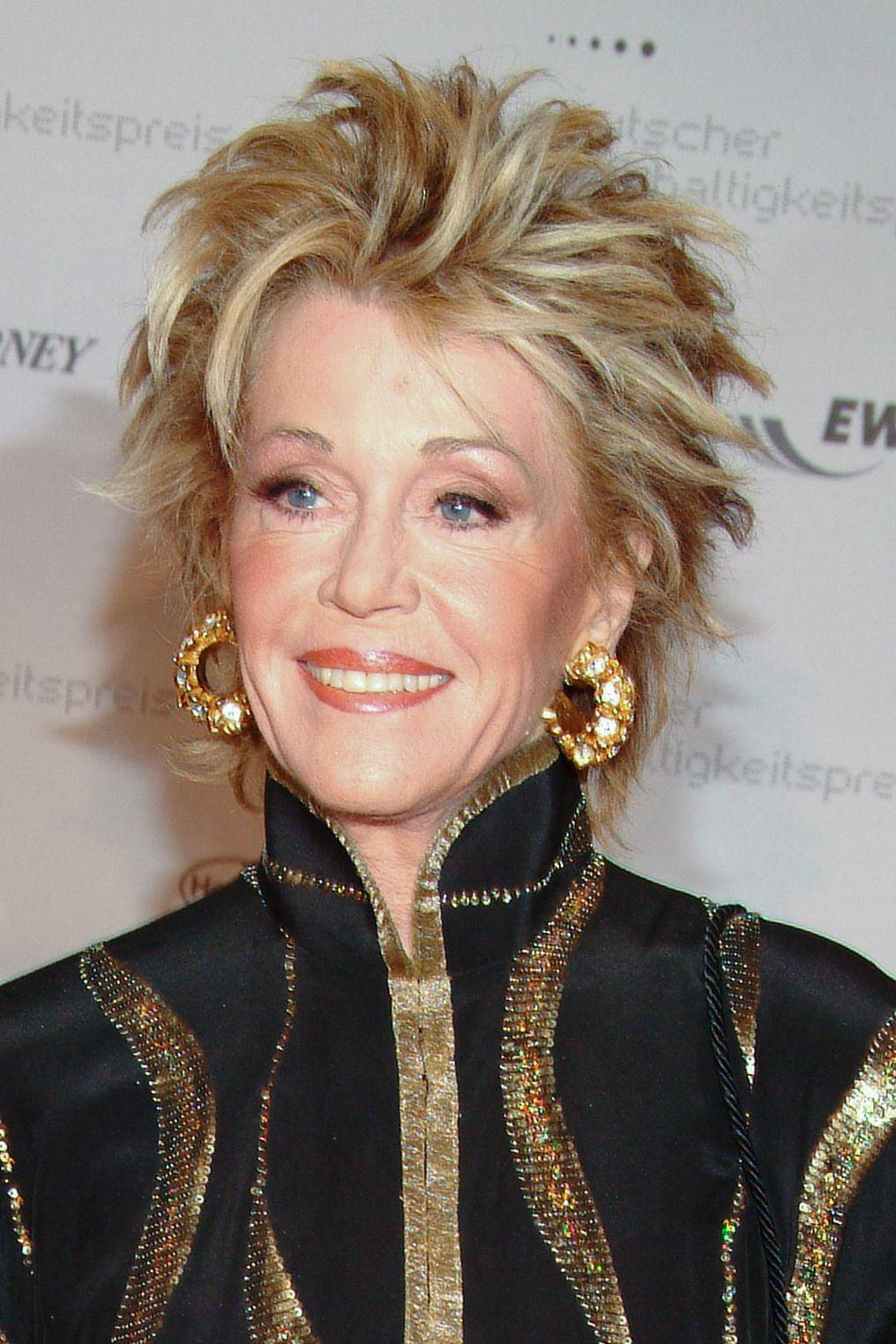 American Actress Jane Fonda In Gold And Black Wallpaper