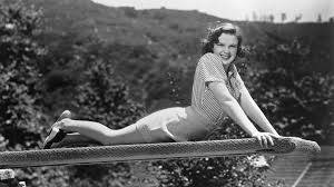 American Actress Judy Garland Posing On Diving Board Wallpaper