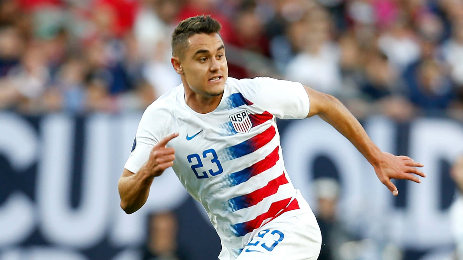 Dynamic American Soccer Player, Aaron Long in Action Wallpaper