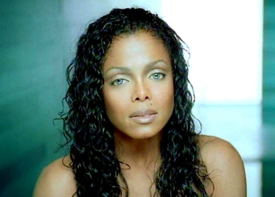 American Celebrity Janet Jackson With Blue Eyes Background