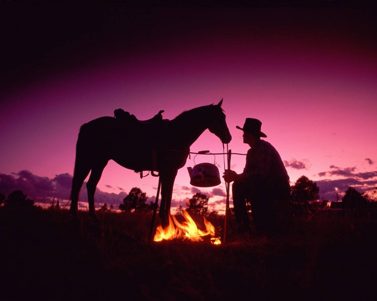 A Cowboy Enjoys Life on the Ranch Wallpaper