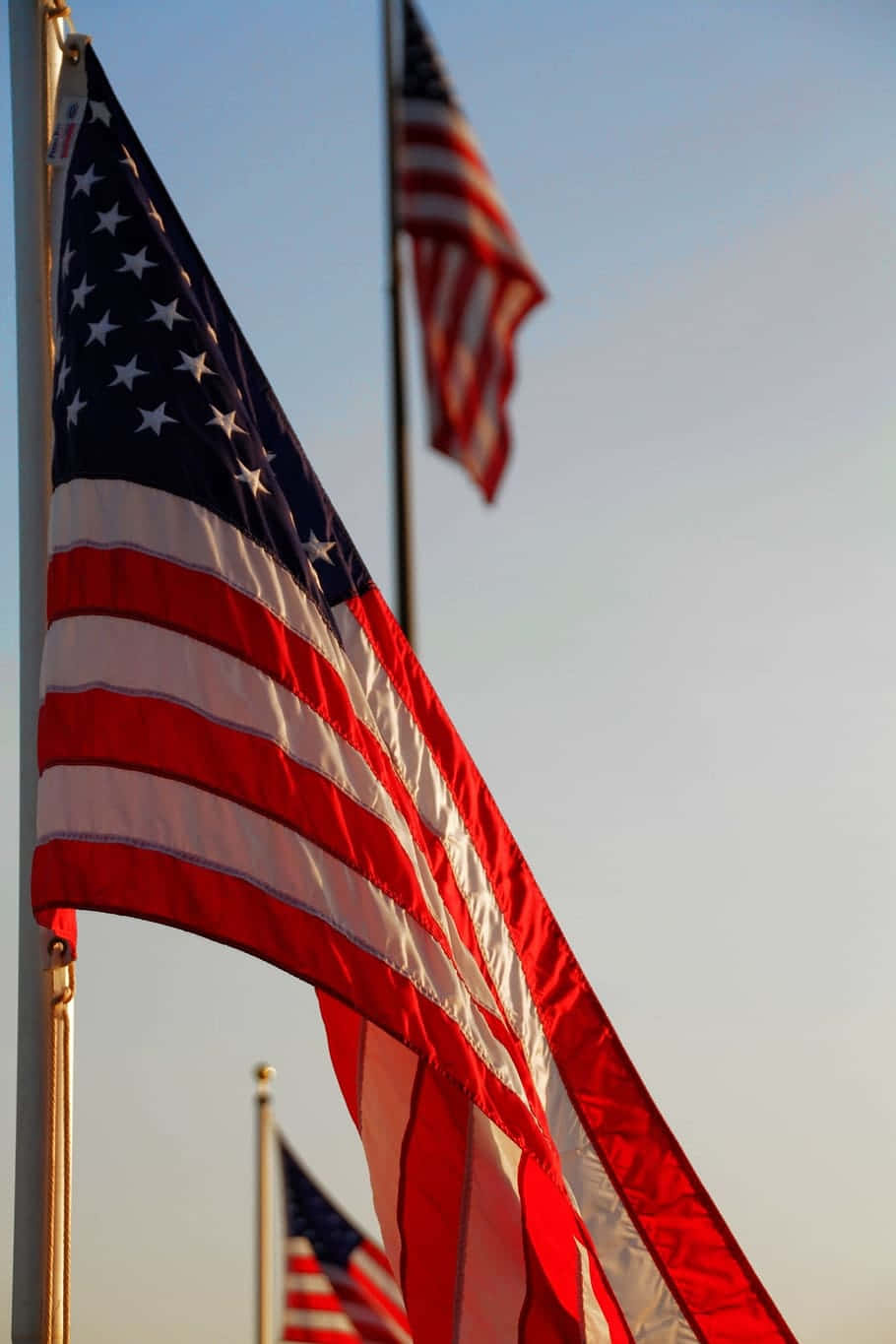 A proud American Flag waving at night