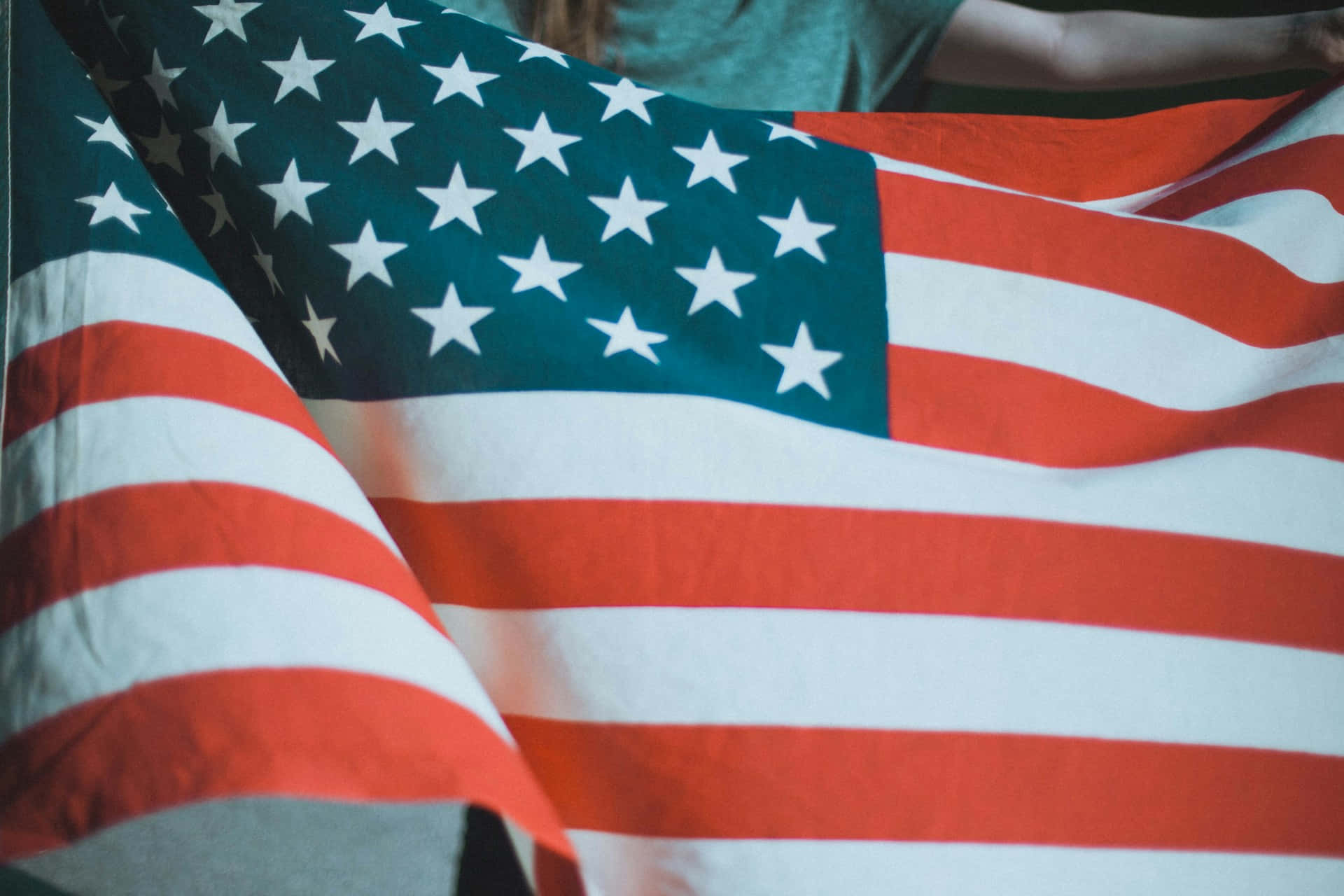 American Flag Drapped Across Shoulders Wallpaper