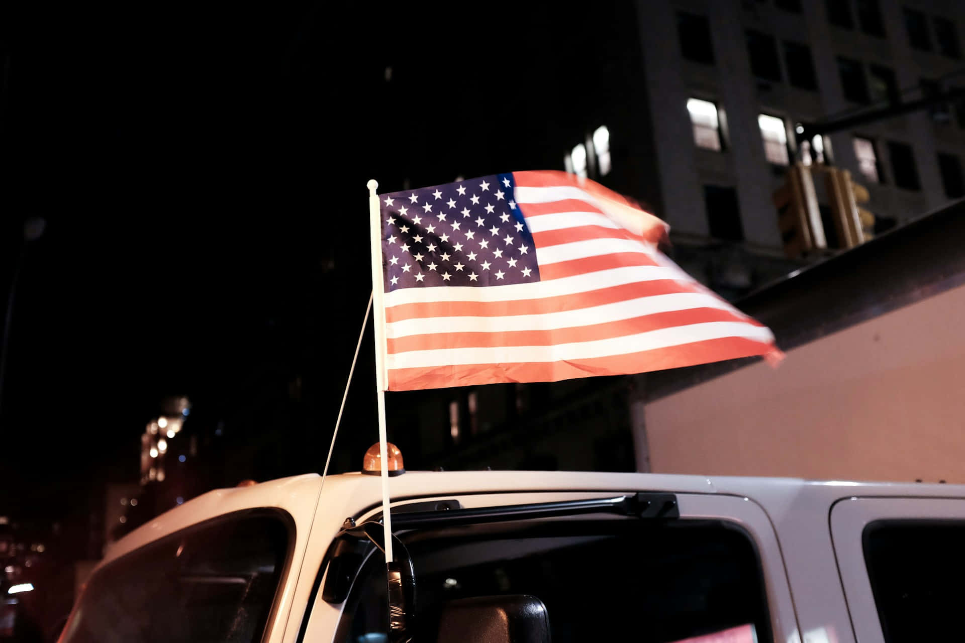 American Flag Nighttime Cityscape Wallpaper