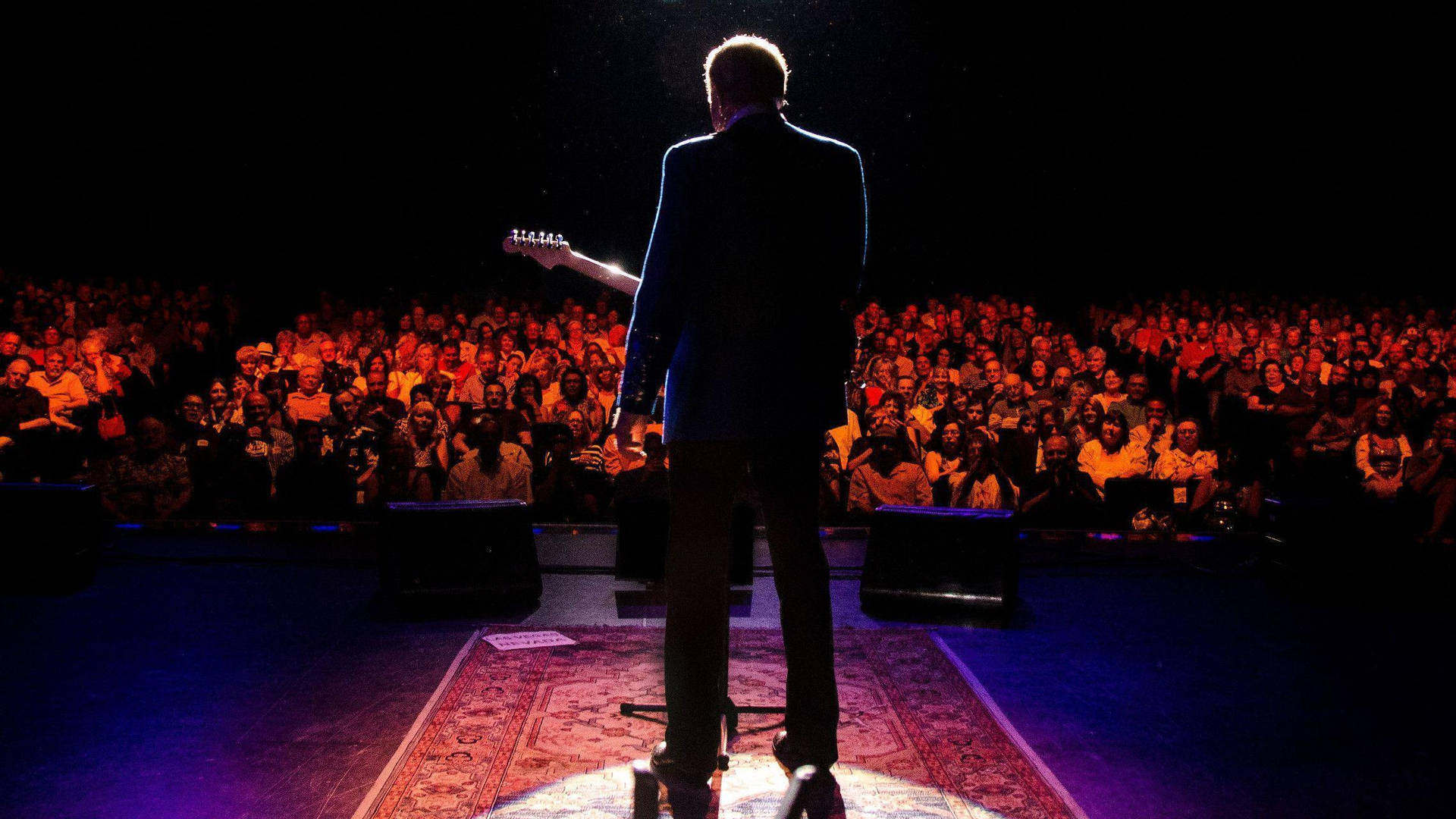 American Guitarist Glen Campbell On The Stage Wallpaper