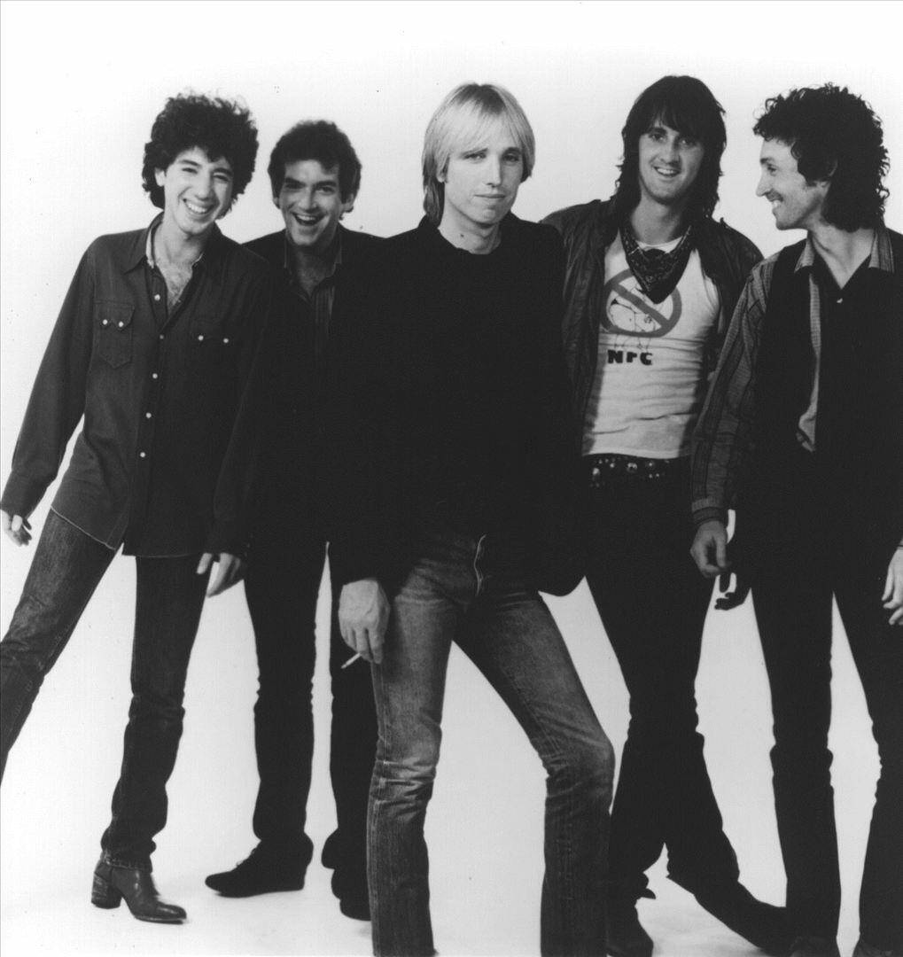 Amerikansk rock band Tom Petty og The Heartbreakers Promotional Portræt Grøn Baggrund Tapet Wallpaper