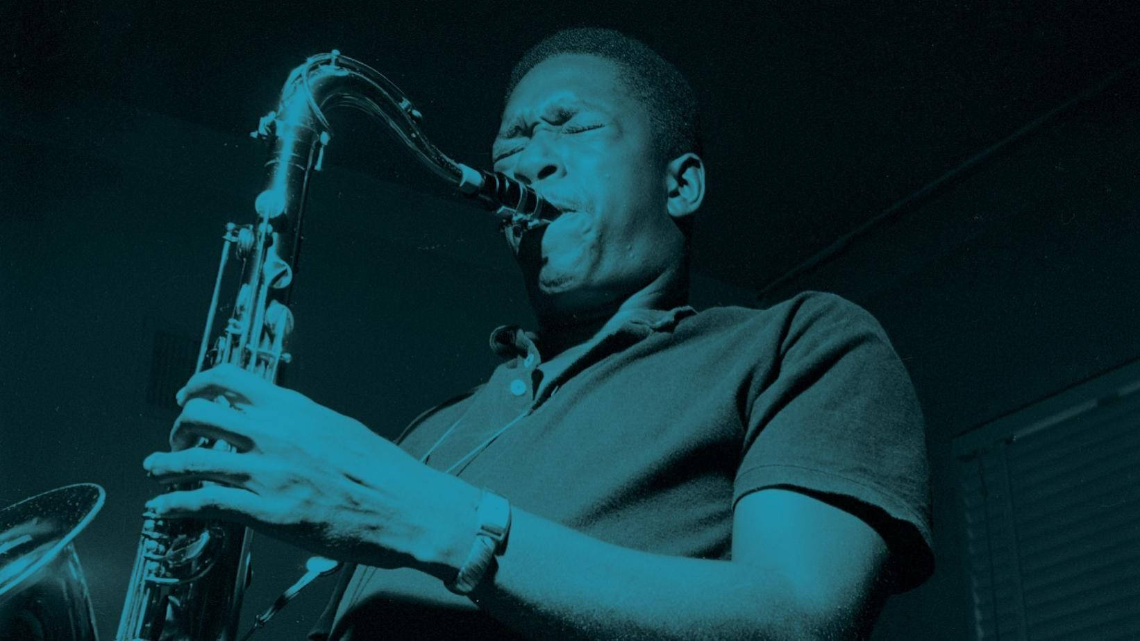 Amerikansk Saxofonist John Coltrane Udsmykker Spotlight i Grammy Museum Tapet Wallpaper