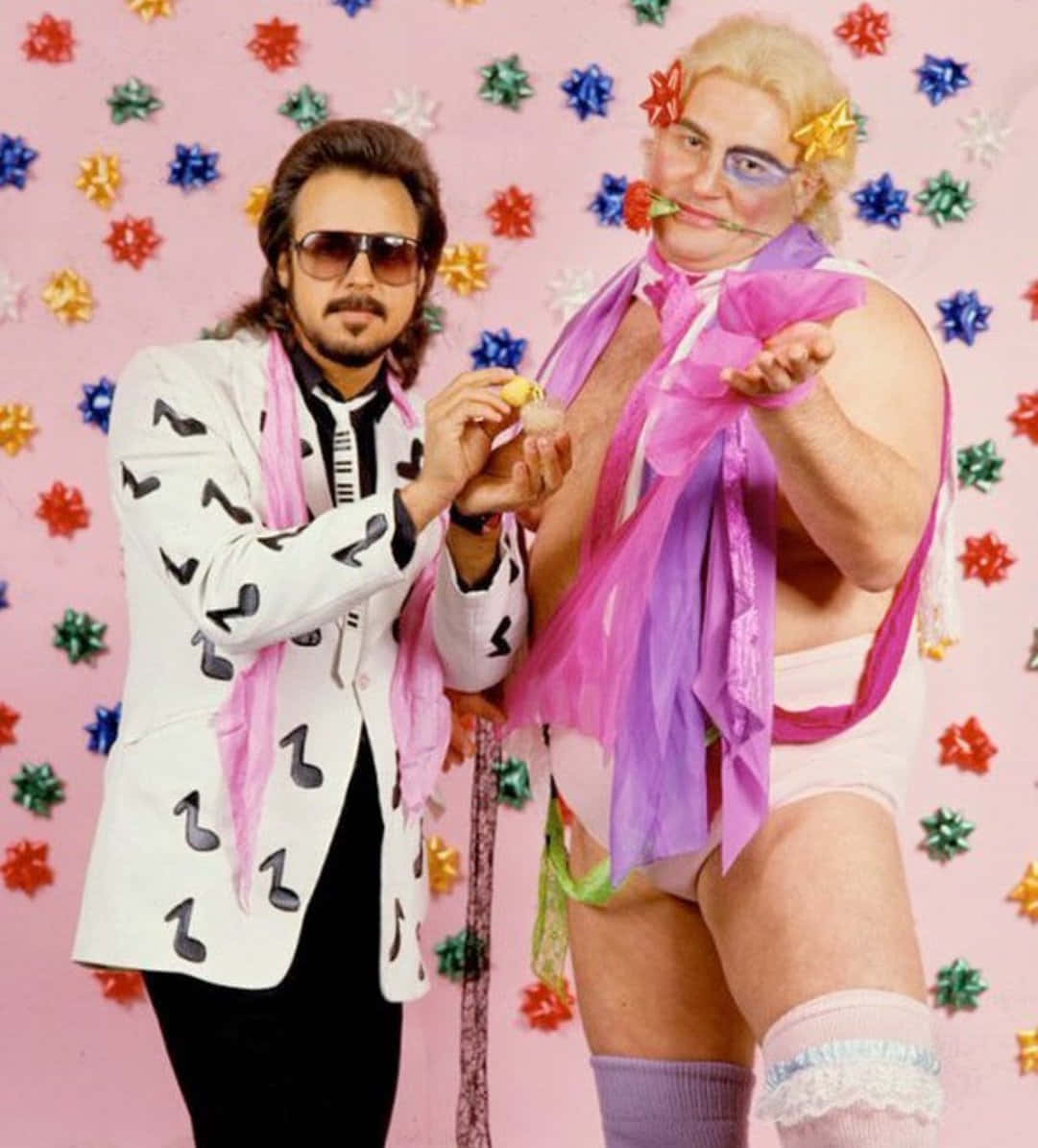 Caption: Legendary American Wrestler Adrian Adonis Pictured with Manager Jimmy Hart Wallpaper
