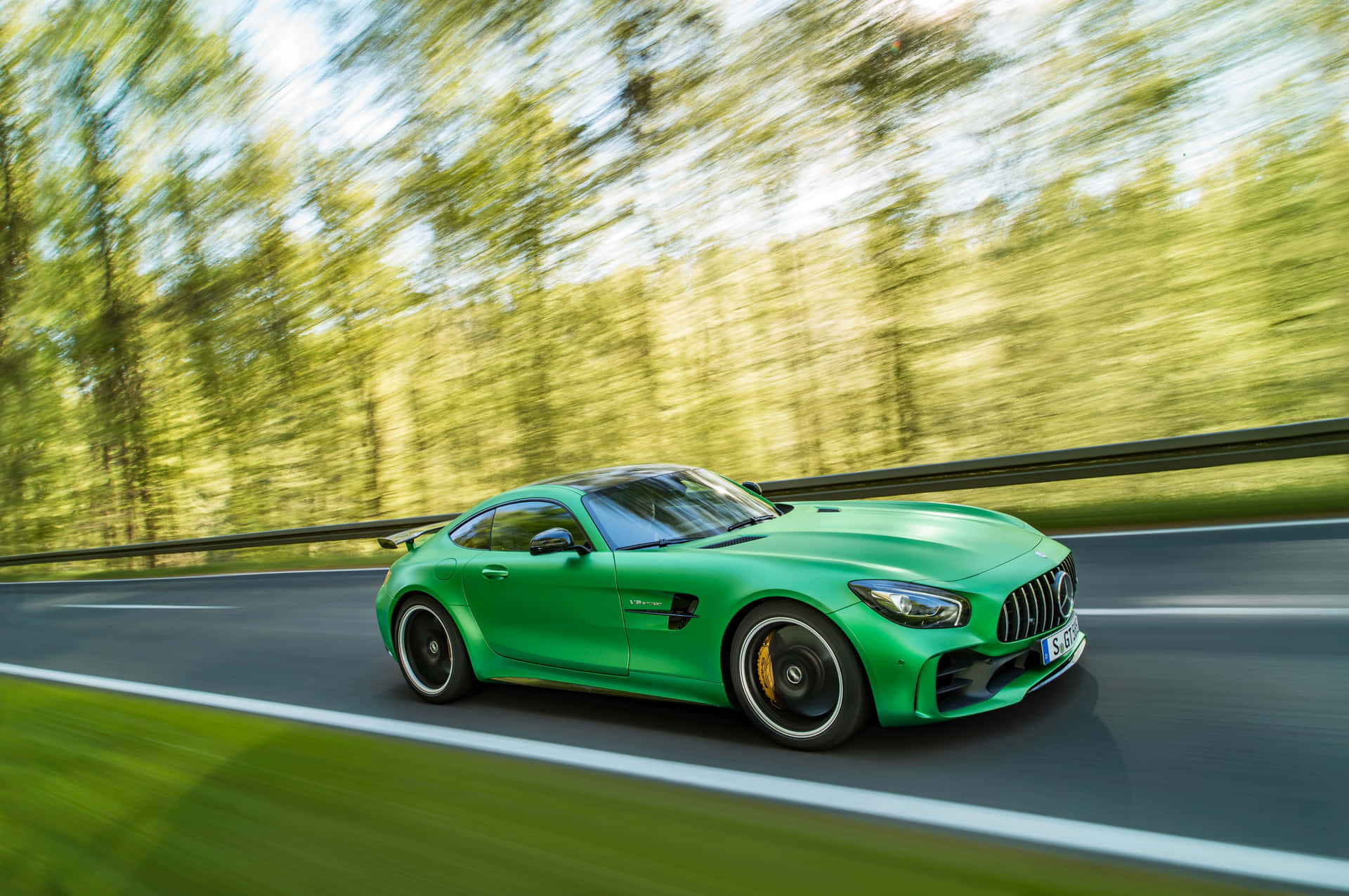 Fast Mercedes AMG GT R With Green Trees Background