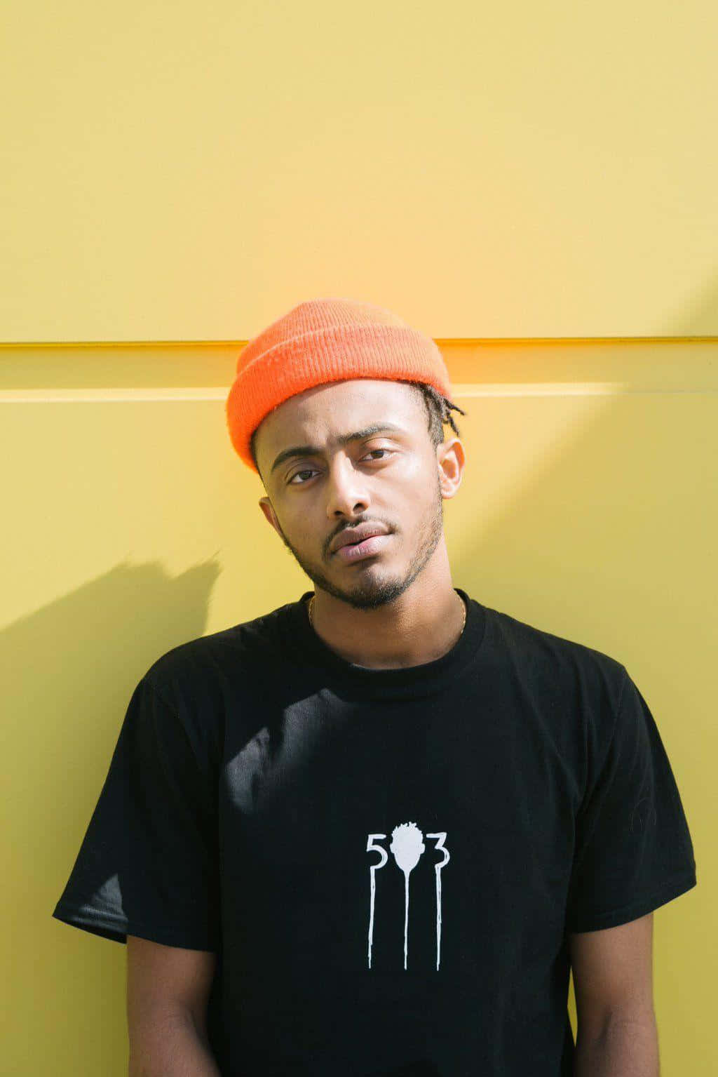 Amine Rapper Pfp With Yellow Wall Wallpaper