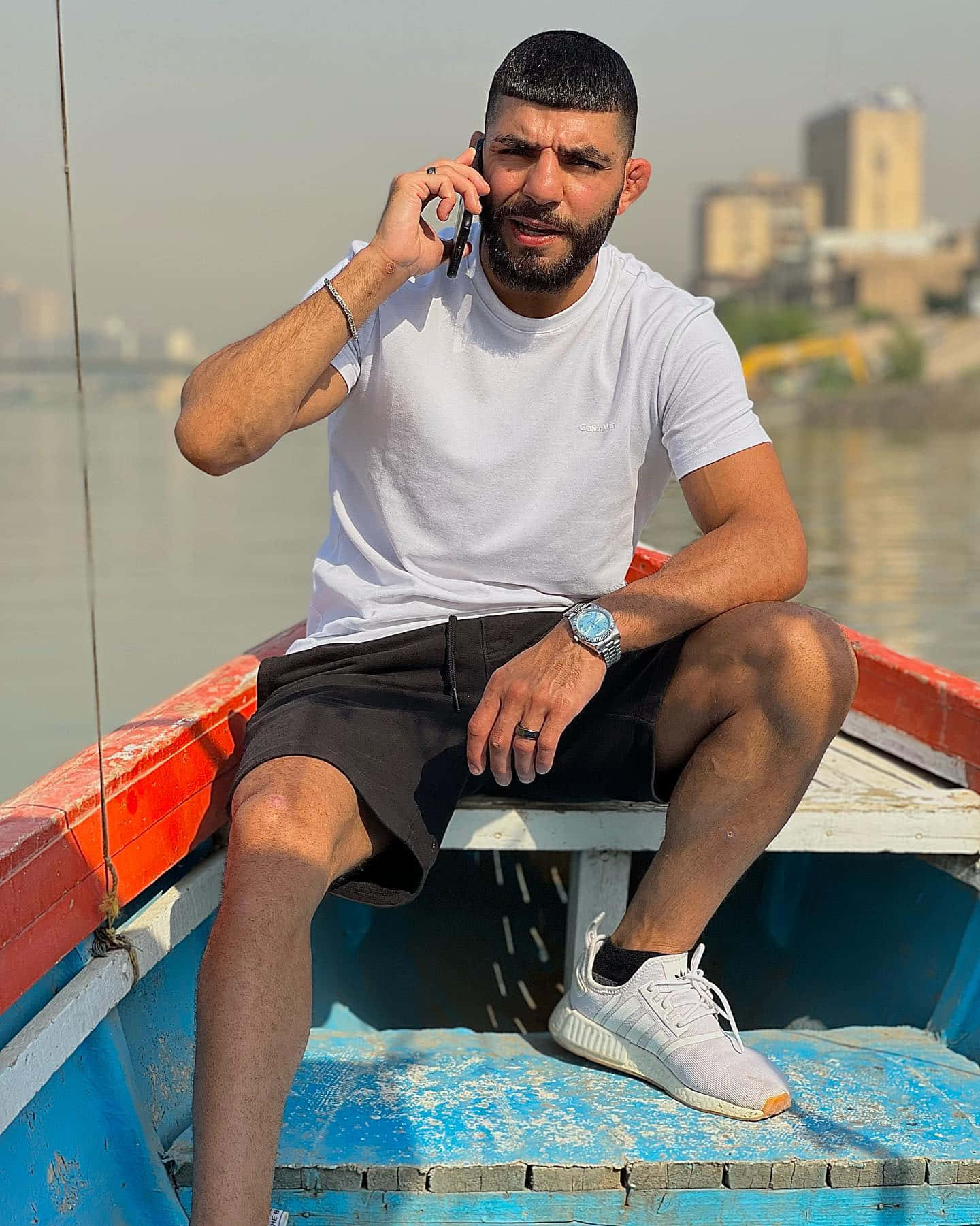 Amir Albazi Calling On Boat Wallpaper