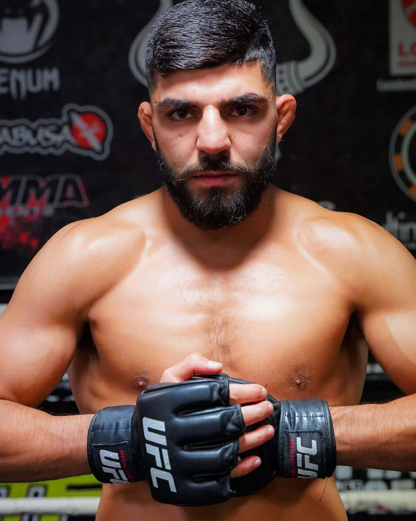Amir Albazi Holding Fist Background