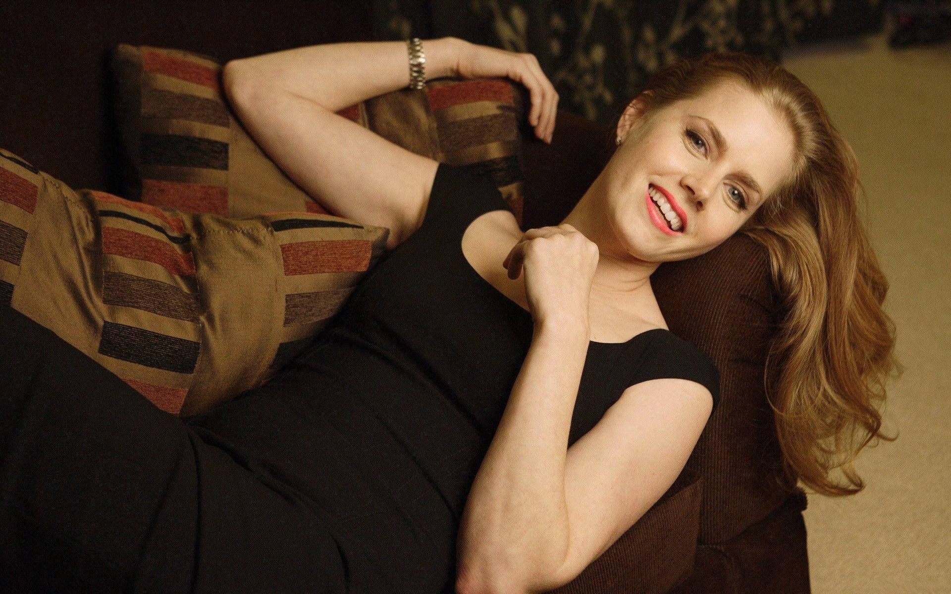 Amy Adams On A Couch Photo Wallpaper