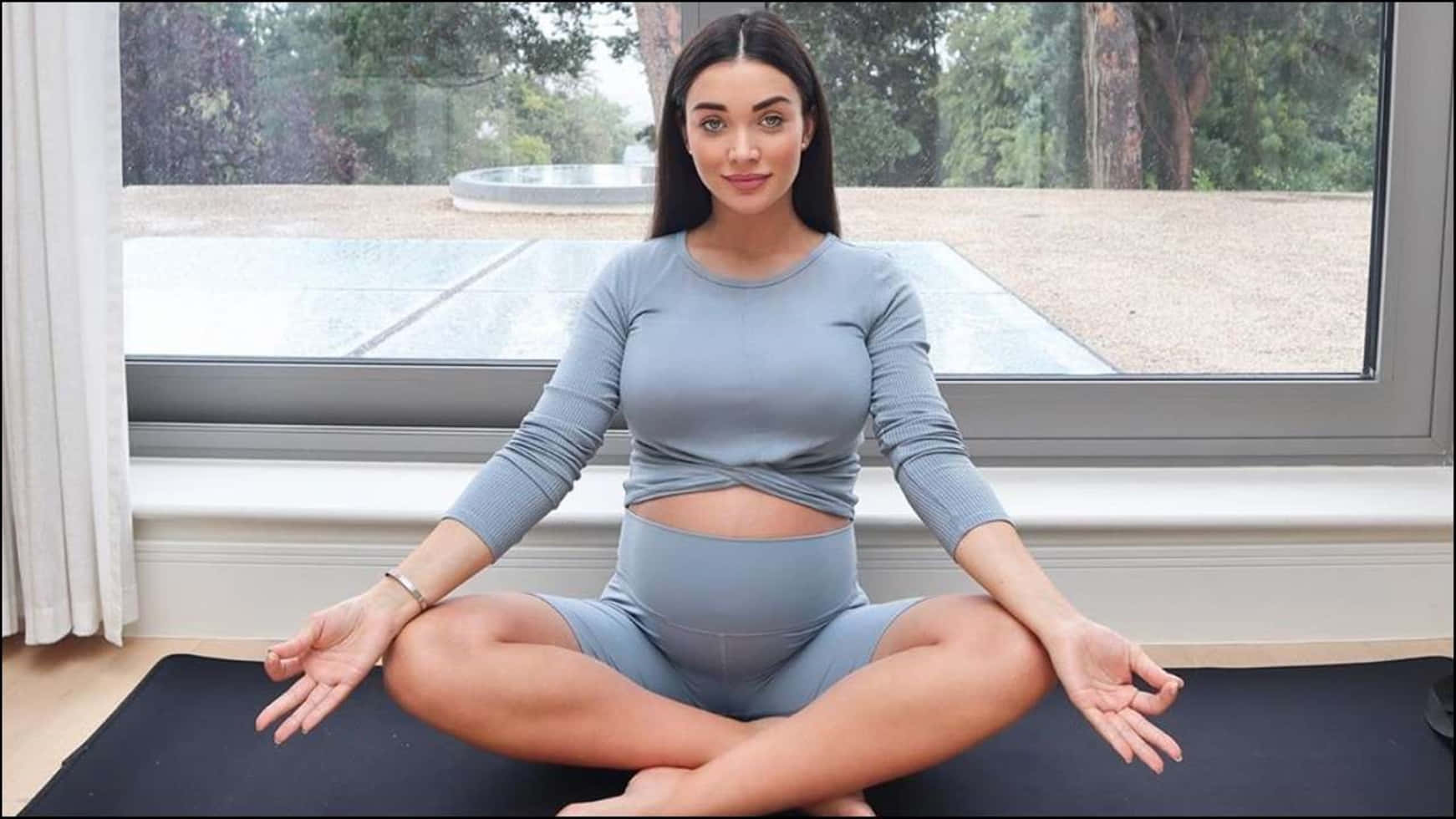 Amy Jackson Meditative Poseby Window Wallpaper