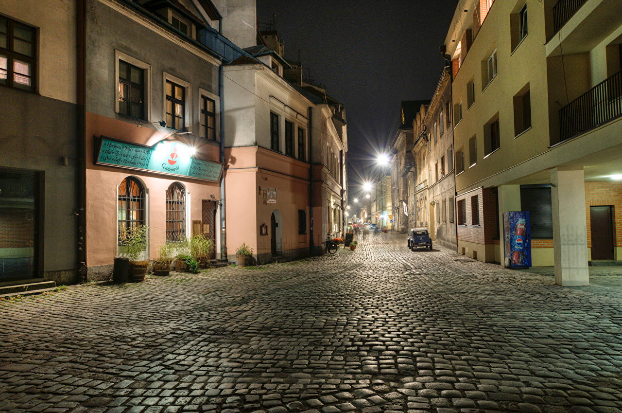 An Empty Street In Krakow, Poland At Night Wallpaper