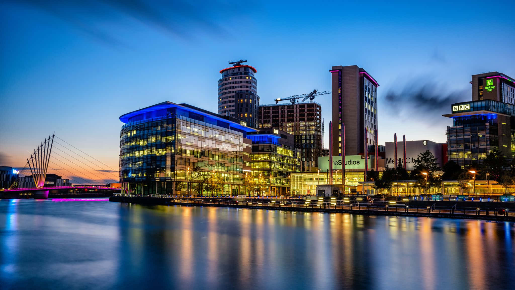 An Iconic View Of Salford Cityscape At Dusk Wallpaper