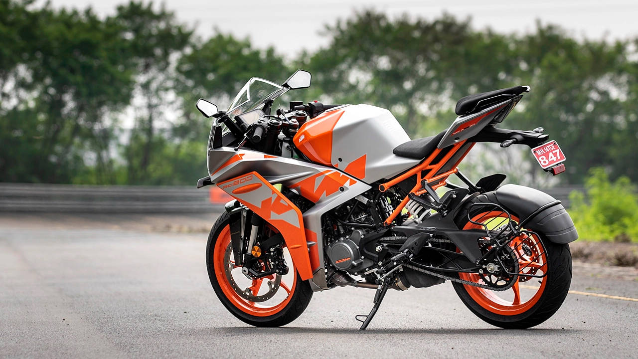 An Orange And Silver Ktm Rc 200 Wallpaper