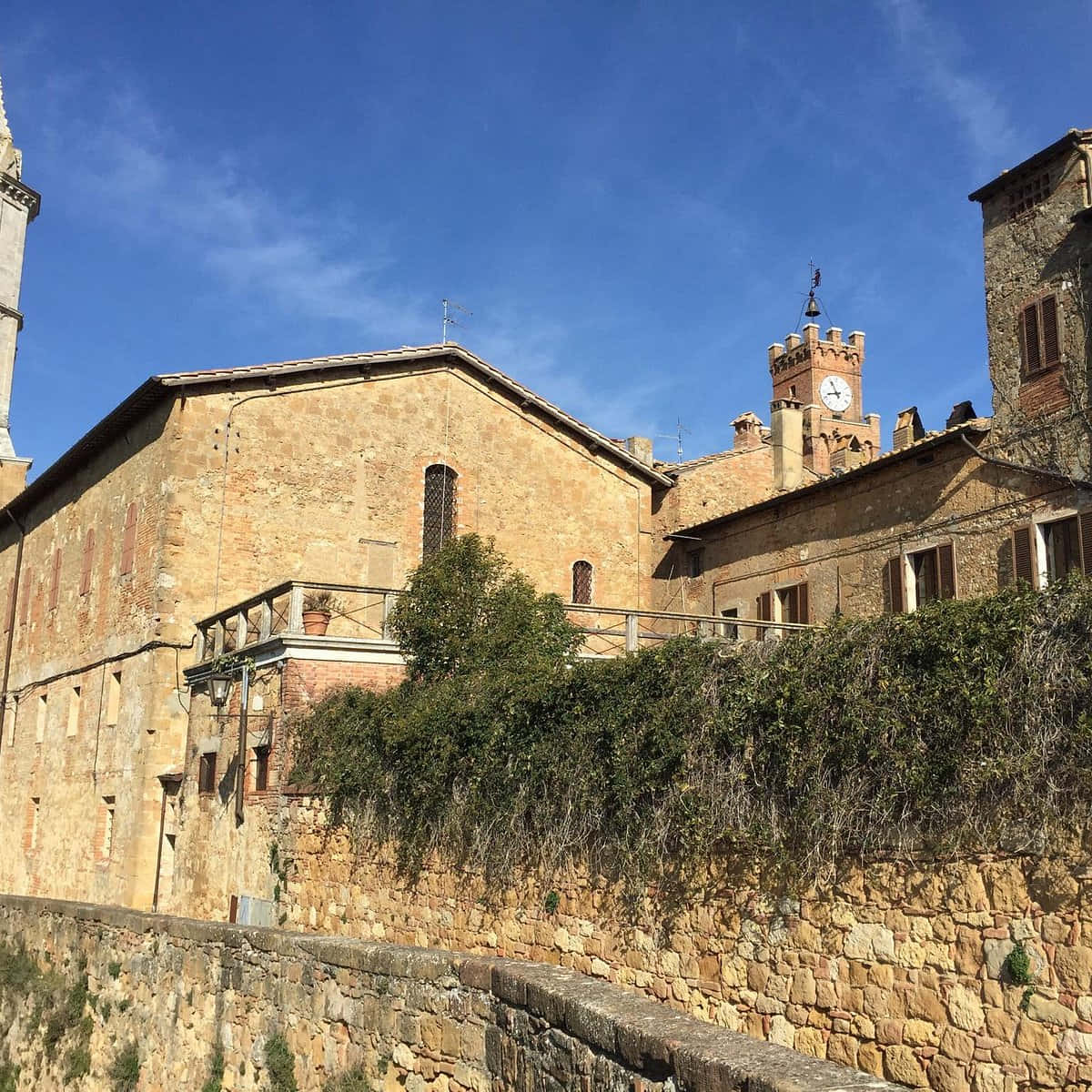 Ancient Buildings With Clock Tower Pienza Italy Wallpaper