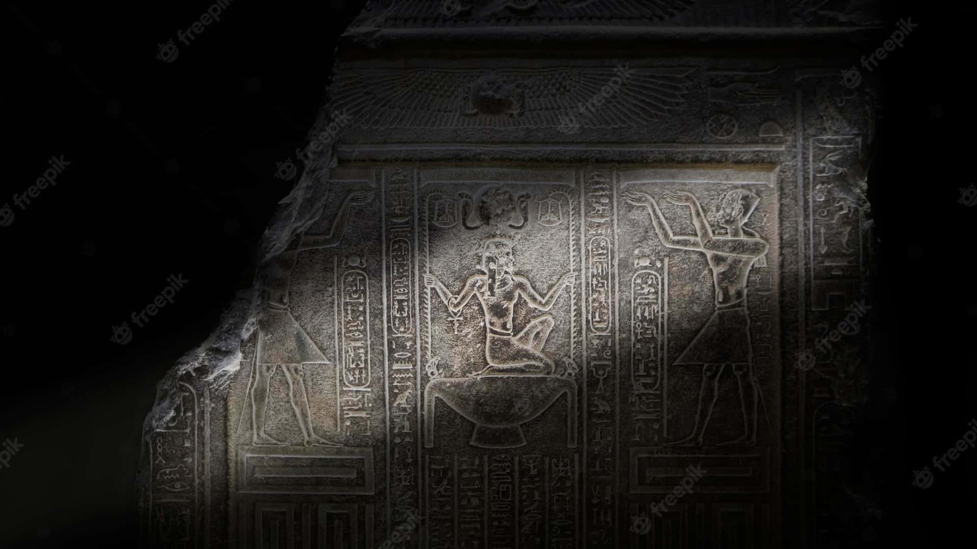 En ægyptisk faraoestatue i mørket Wallpaper