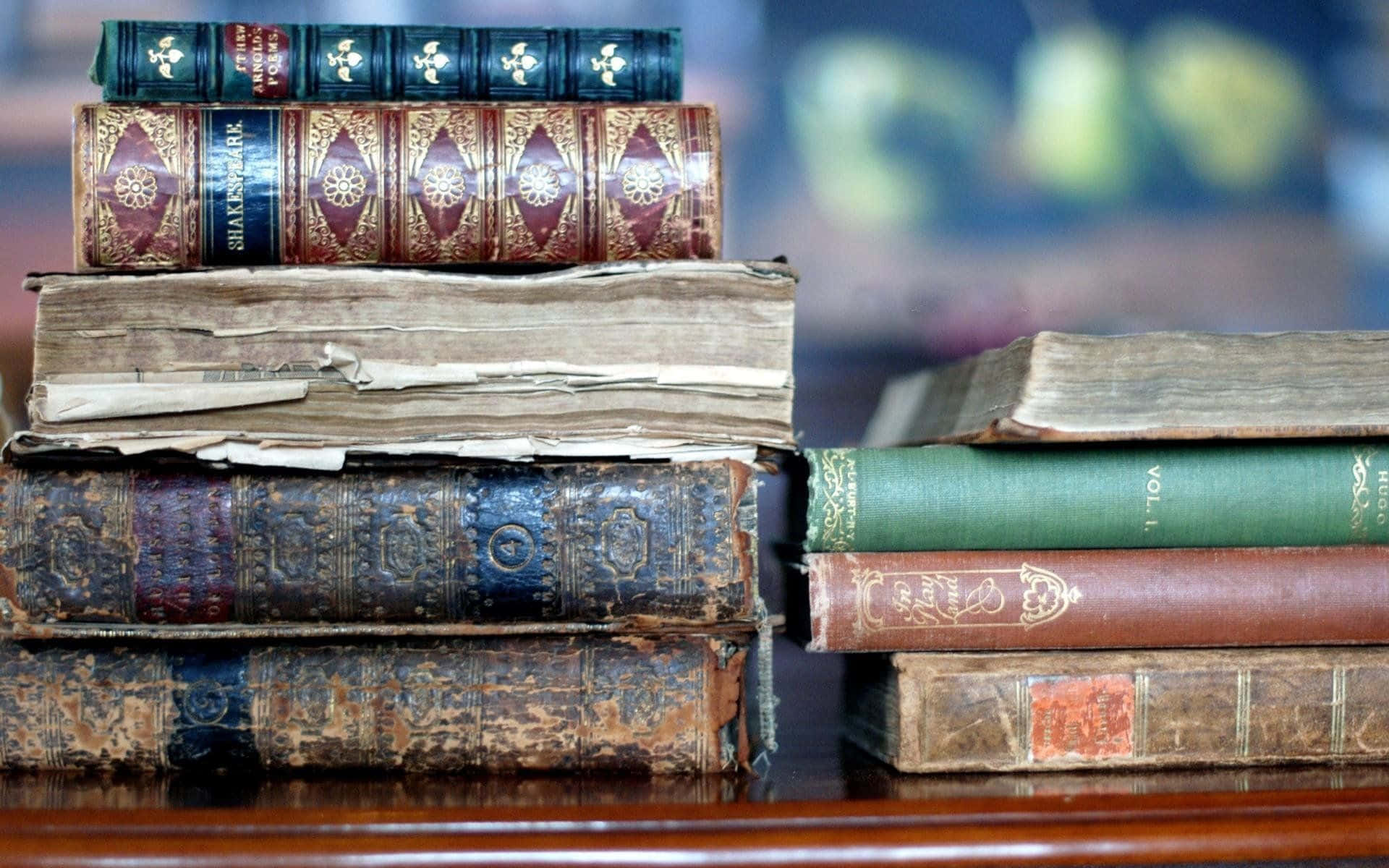 Ancient Wisdom In Print: An Antique Book Collection Wallpaper