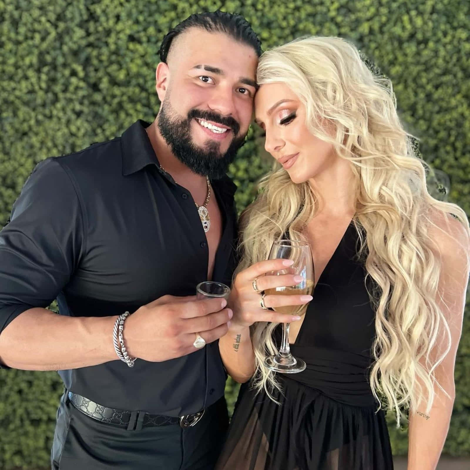 Andrade El Idolo And Charlotte Flair Drinking Wine Wallpaper