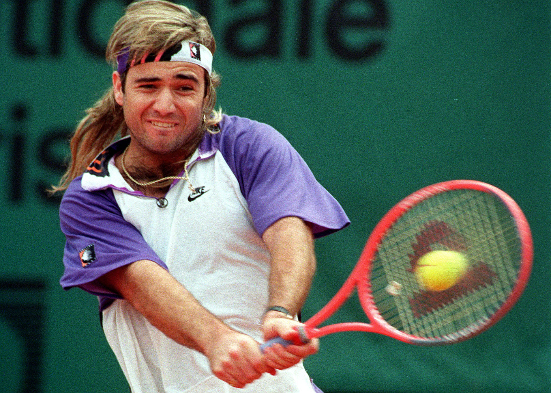 Andre Agassi's Powerful Backhand Stroke Wallpaper