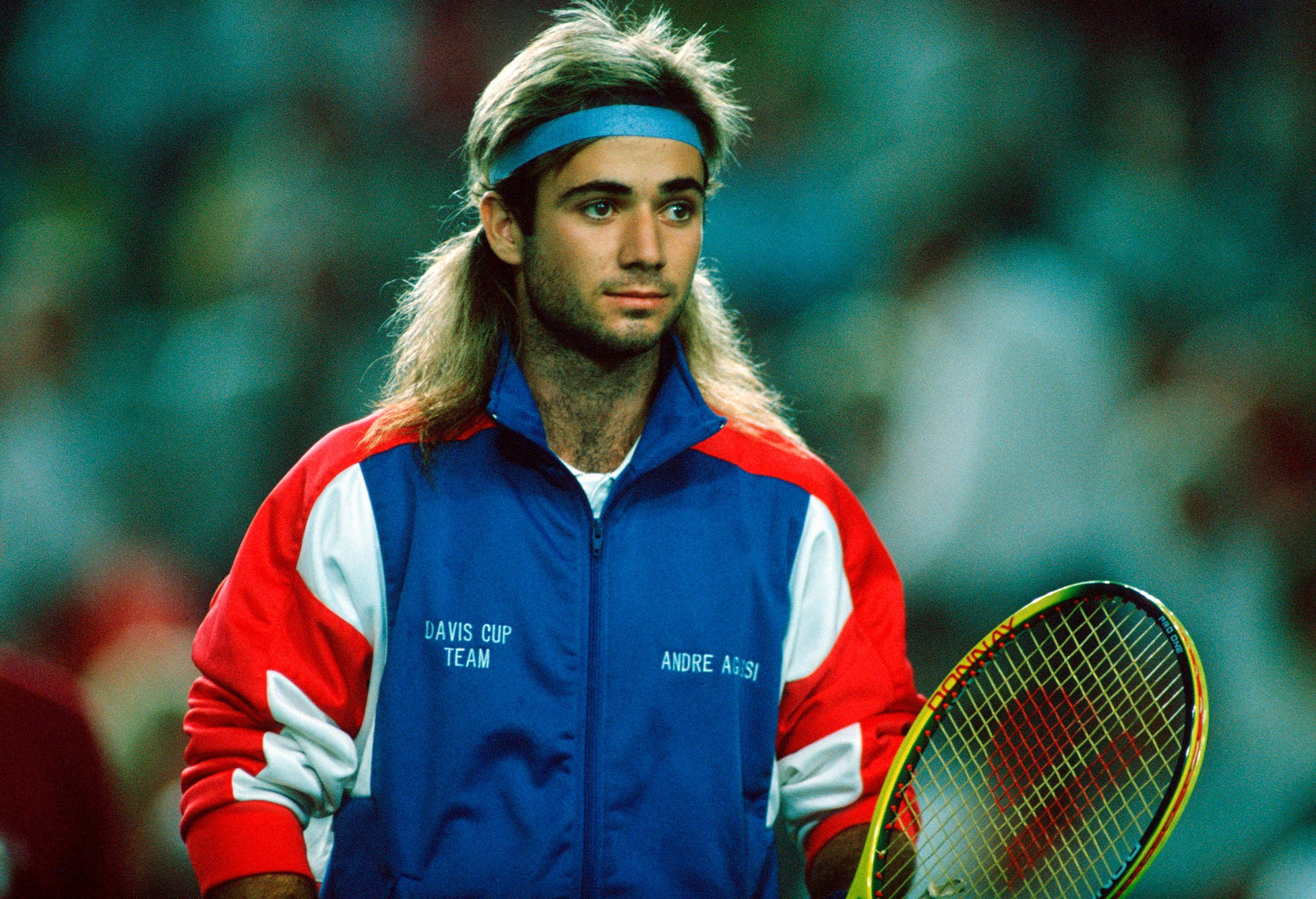 Andre Agassi Sporting Blue Headband on Tennis Court Wallpaper