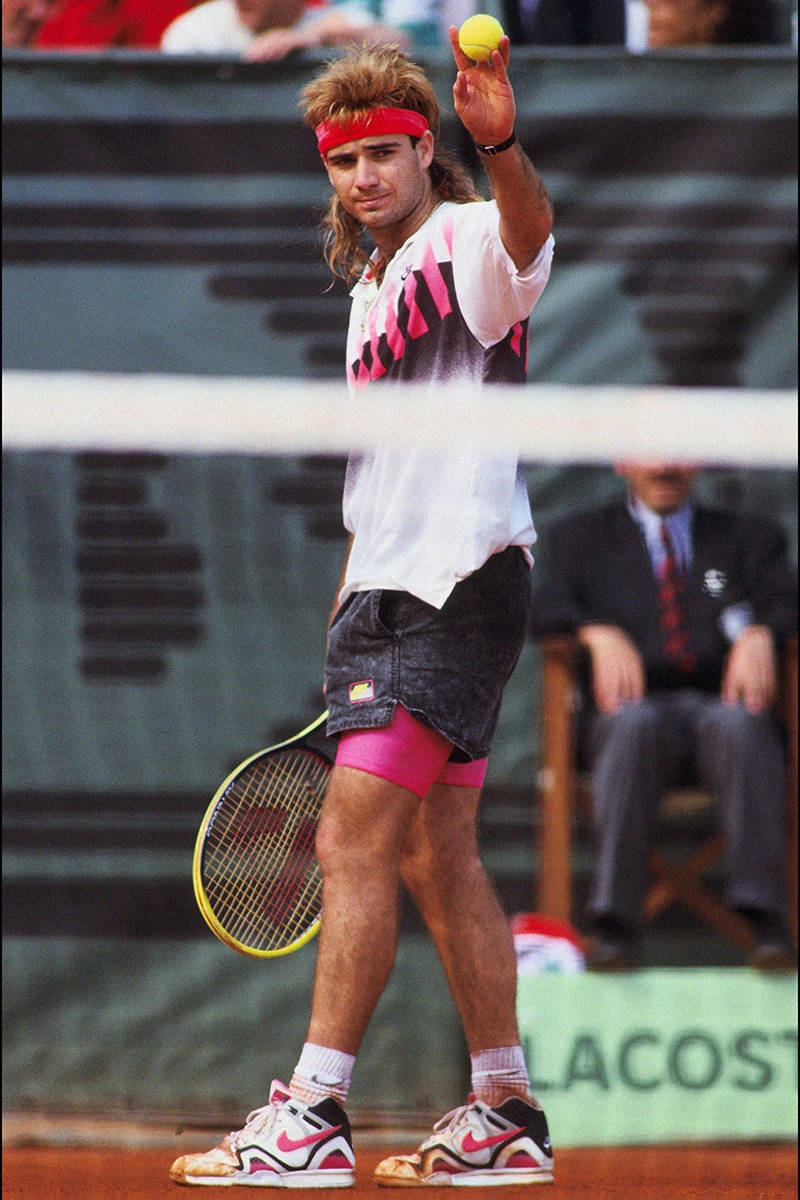 Andre Agassi Holding A Tennis Ball Wallpaper