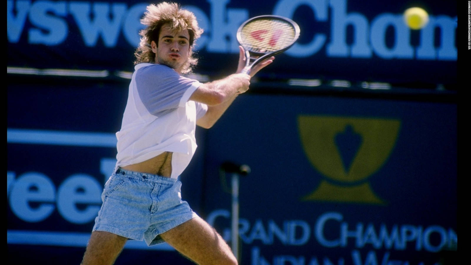 Andre Agassi sporting iconic denim shorts Wallpaper