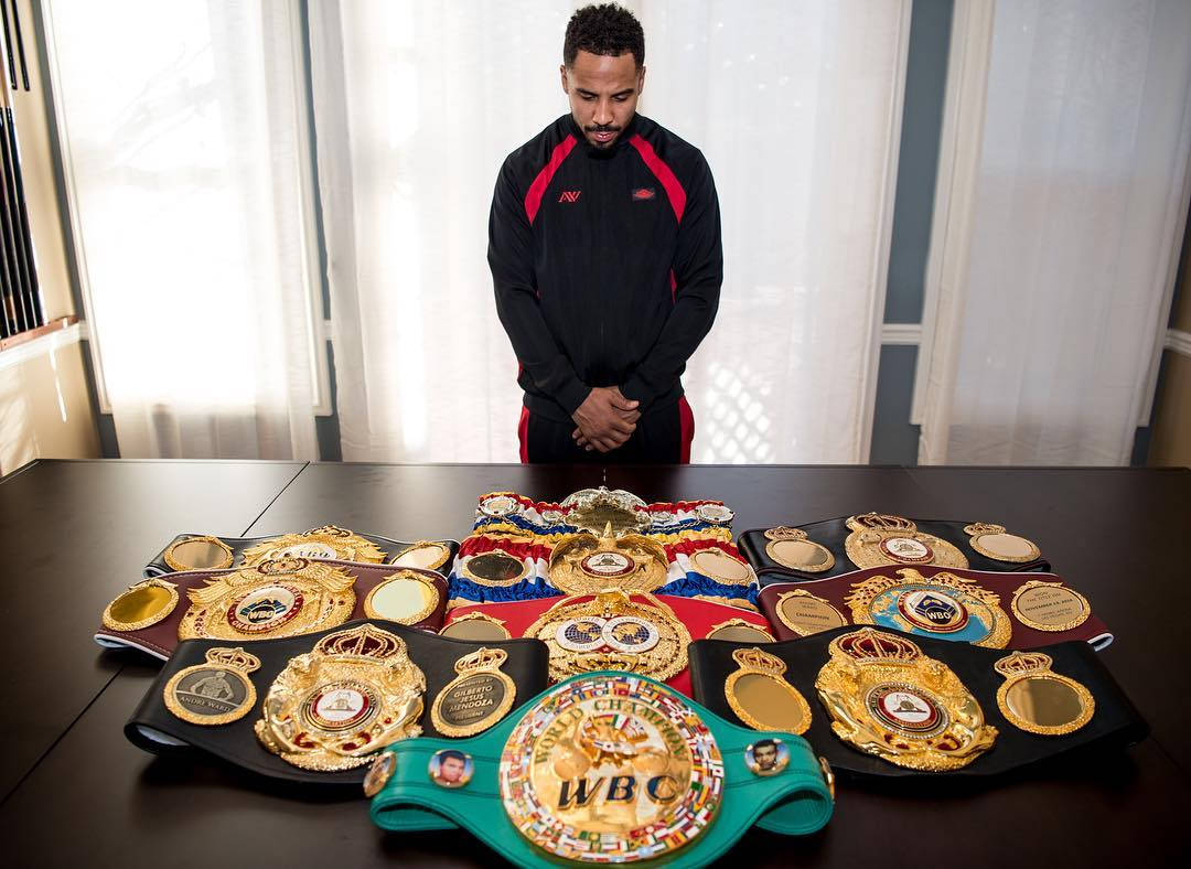 Andre Ward Looking At His Title Belts Wallpaper