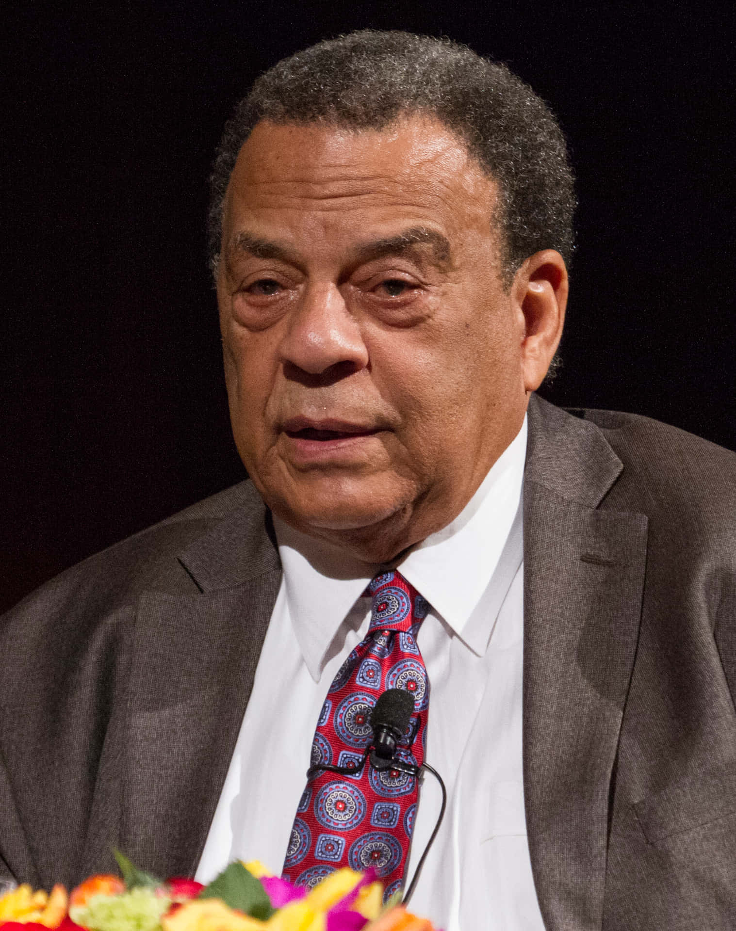 Andrew Young In Front Of Flowers Wallpaper