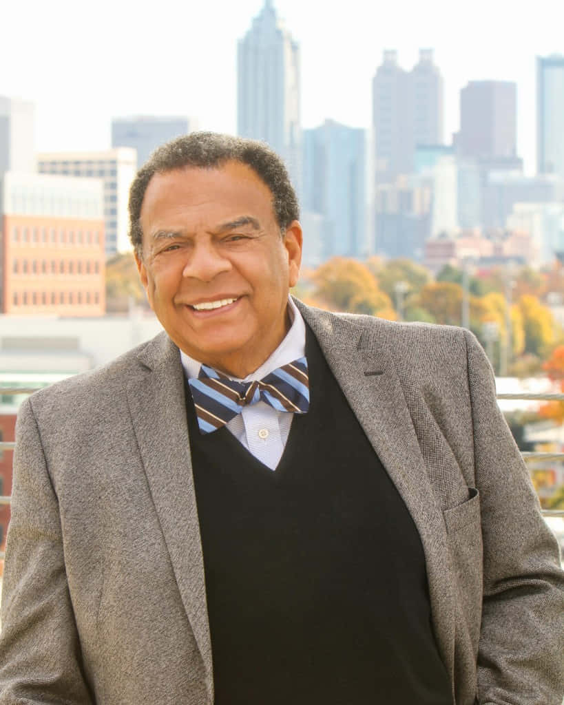 Distinguished Portrait of Andrew Young Donning a Multicolored Bowtie Wallpaper