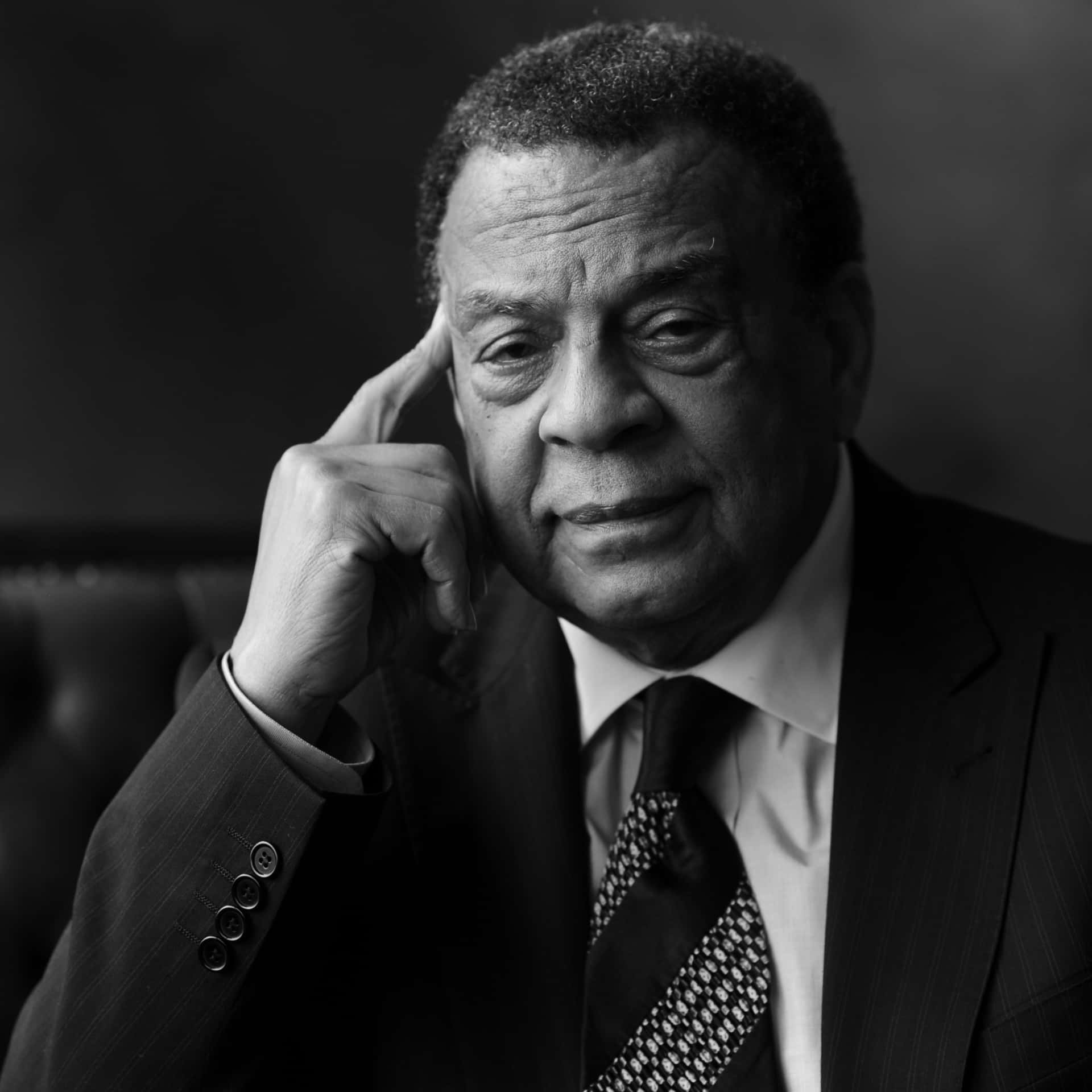 Andrew Young Posing With Finger On Temple Wallpaper