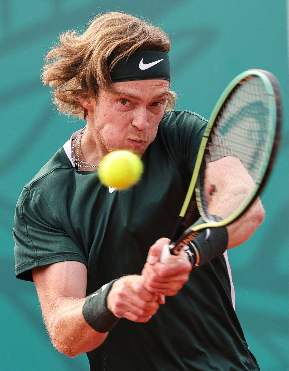 Andrey Rublev Delivering a Powerful Backhand Wallpaper