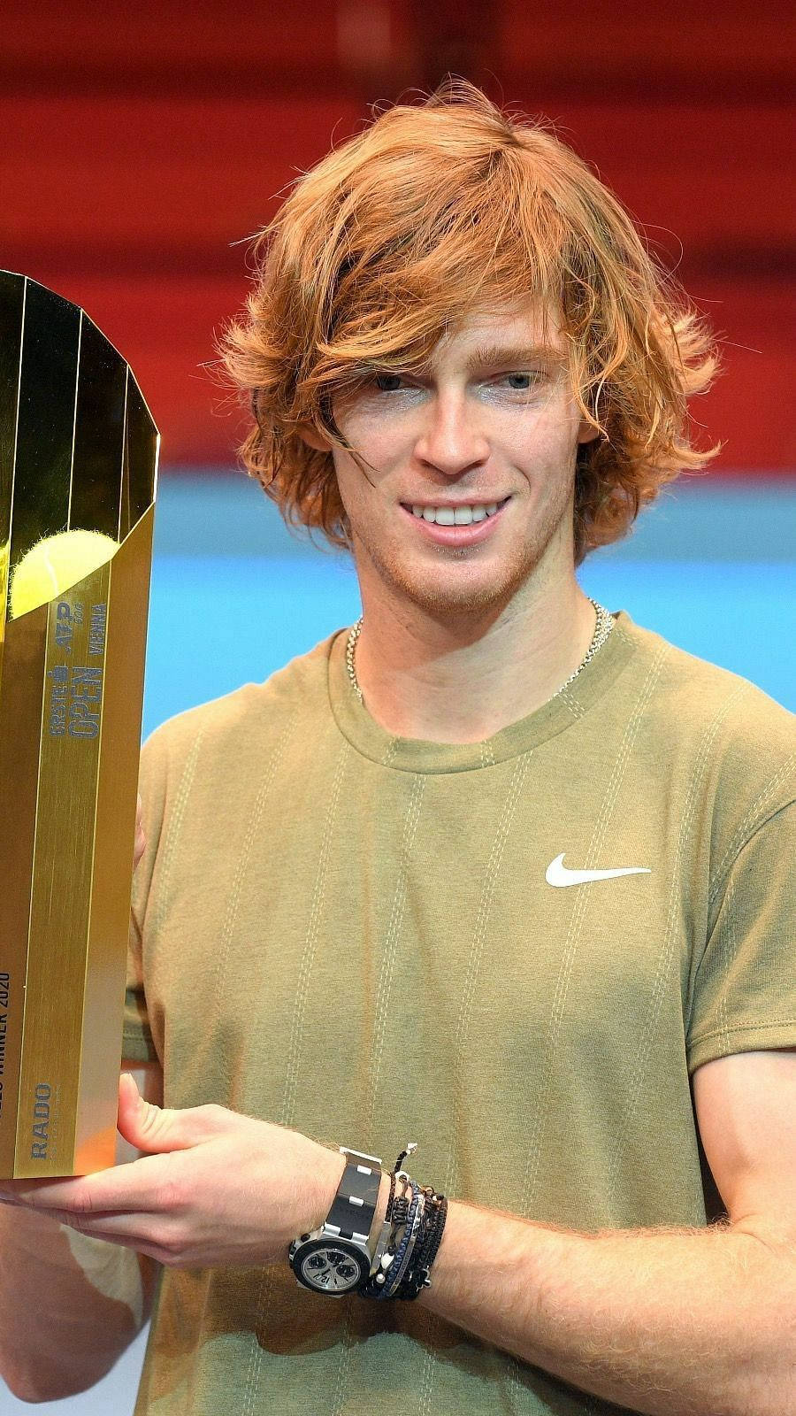 Andrey Rublev Holding A Gold Trophy Wallpaper