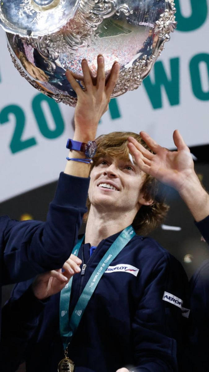 Andrey Rublev Looking At A Trophy Wallpaper