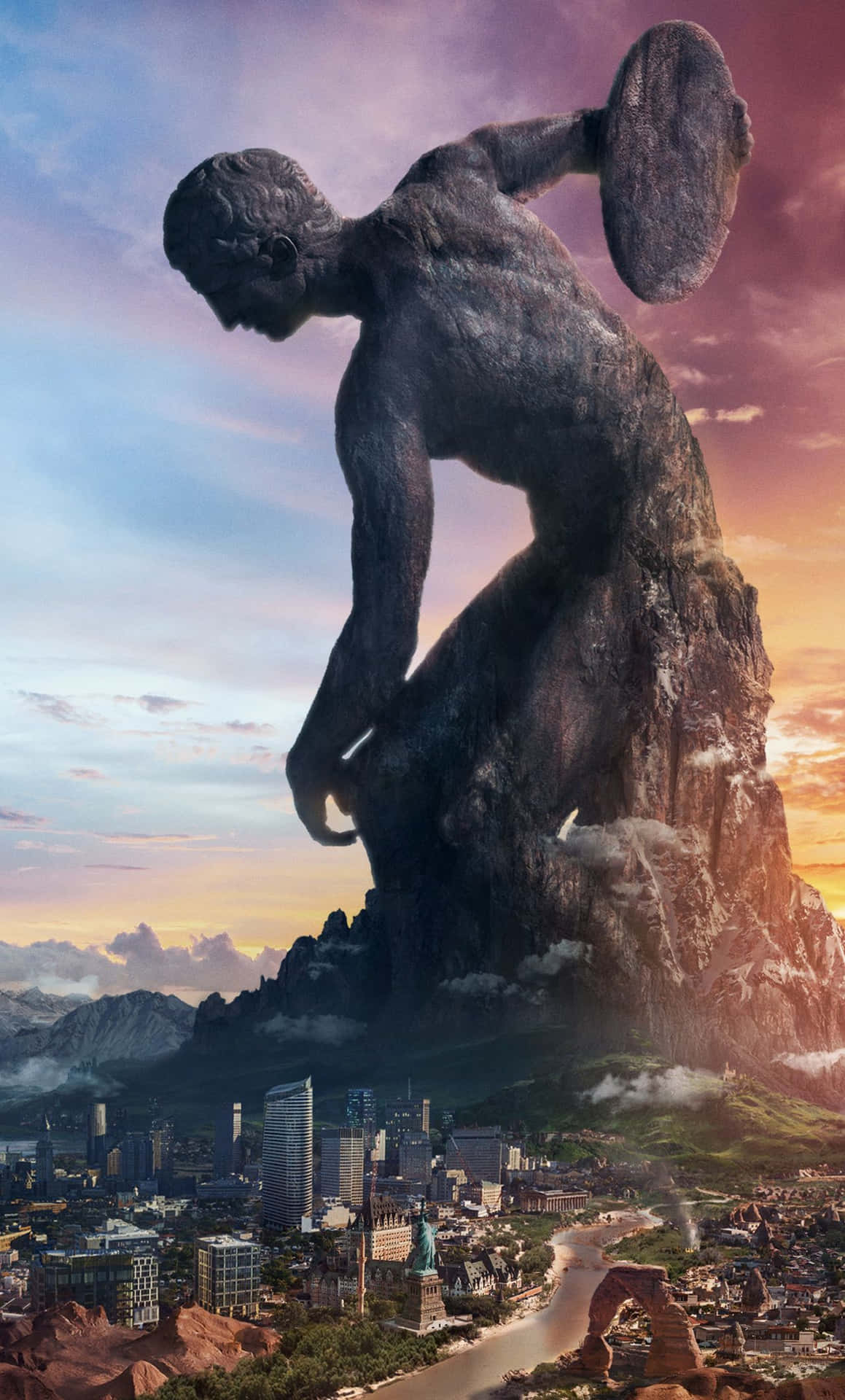 A Statue Of A Man On Top Of A Mountain