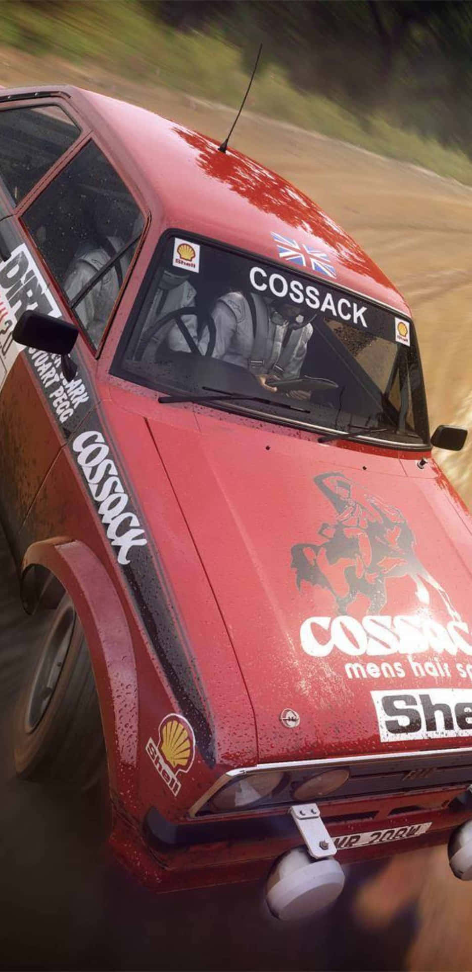 A Red Car Driving Through A Dirt Road