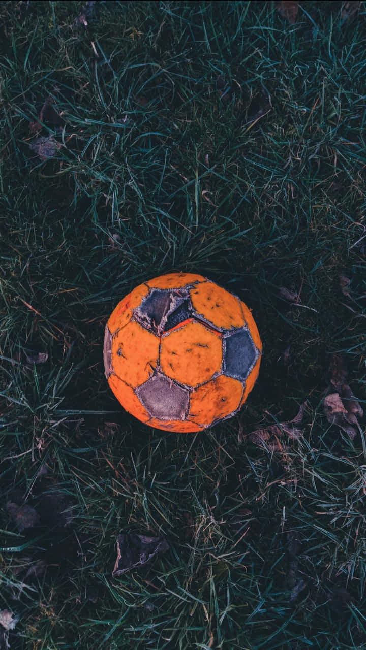 A Soccer Ball Sitting In The Grass
